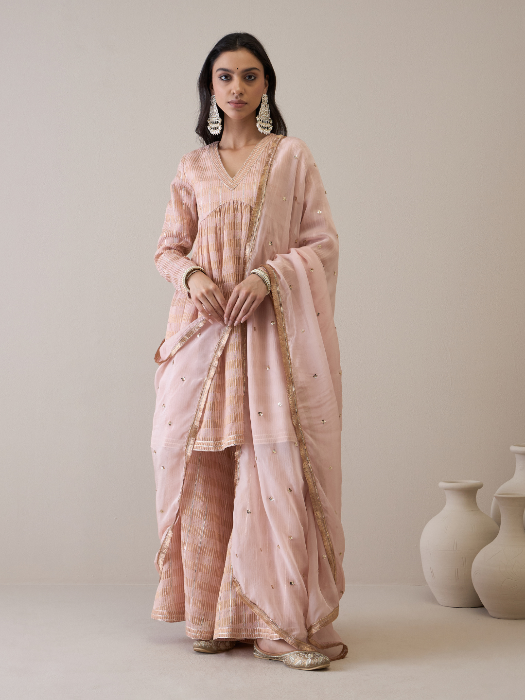 Peach Chanderi Silk Gota Embroidered Sharara Set at Kamakhyaa by RoohbyRidhimaa. This item is Avani by RoohbyRidhimaa, Chanderi Silk, Ethnic Wear, Gotta Embroidery, Pink, Relaxed Fit, Sequin Embroidered, Sharara Sets, Silk Chanderi, Silk Organza, Toxin free