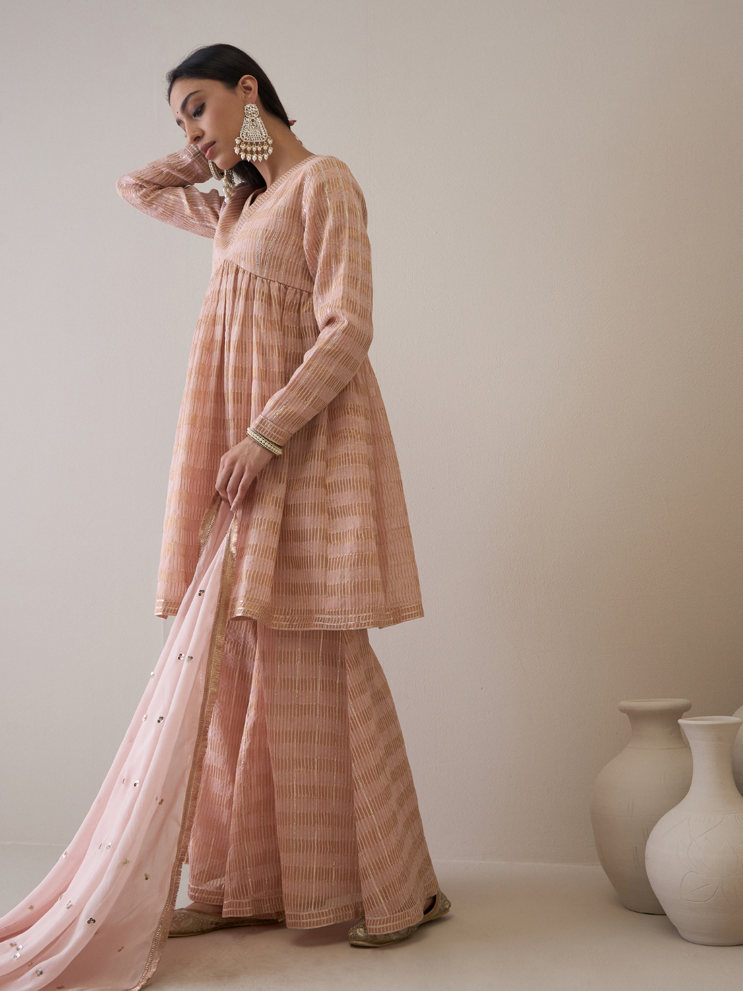 Peach Chanderi Silk Gota Embroidered Sharara Set at Kamakhyaa by RoohbyRidhimaa. This item is Avani by RoohbyRidhimaa, Chanderi Silk, Ethnic Wear, Gotta Embroidery, Pink, Relaxed Fit, Sequin Embroidered, Sharara Sets, Silk Chanderi, Silk Organza, Toxin free