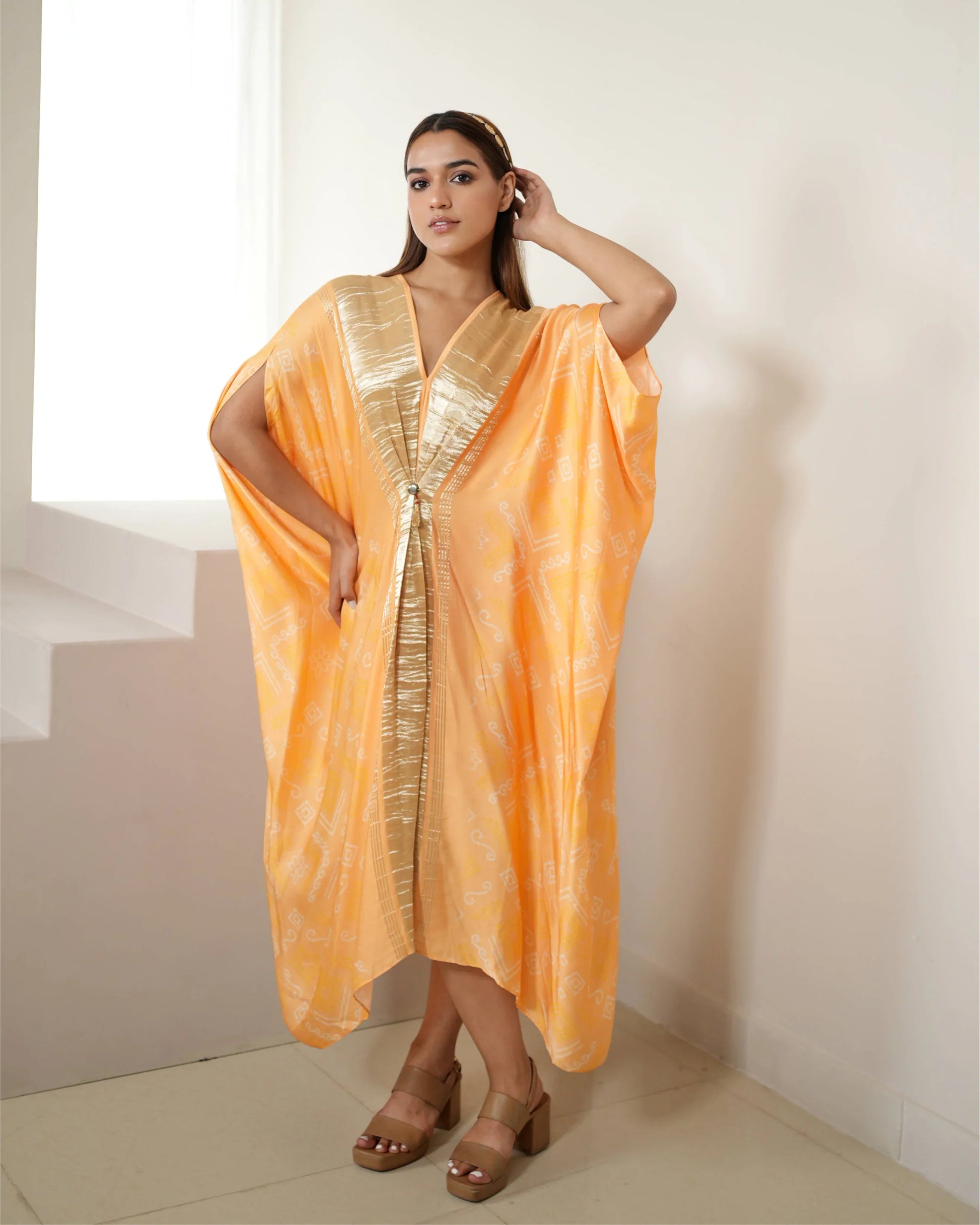 Peach Zari Weave Free Size Kaftan at Kamakhyaa by Mayura Kumar. This item is Bandhej, Bandhej Bandhini Mixology by Mayura Kumar, Dry clean, Festive Wear, Modal Satin Silk, Pink, Relaxed Fit, Satin Silk, Silk, Tie-Dye