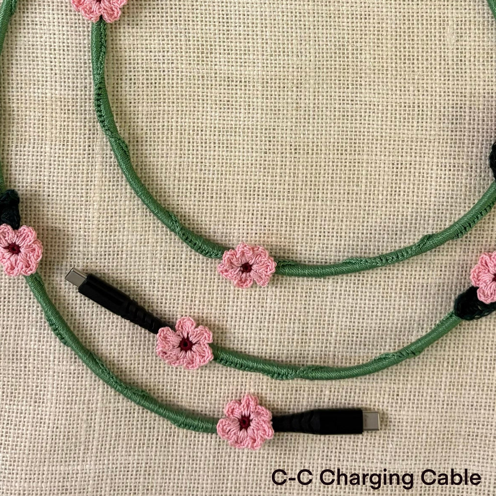 Pink Daisy Crochet Charging Cord C-C Cable at Kamakhyaa by Ikriit'm. This item is Bloom by Ikriit'm, Crochet, Relaxed Fit, Under $50