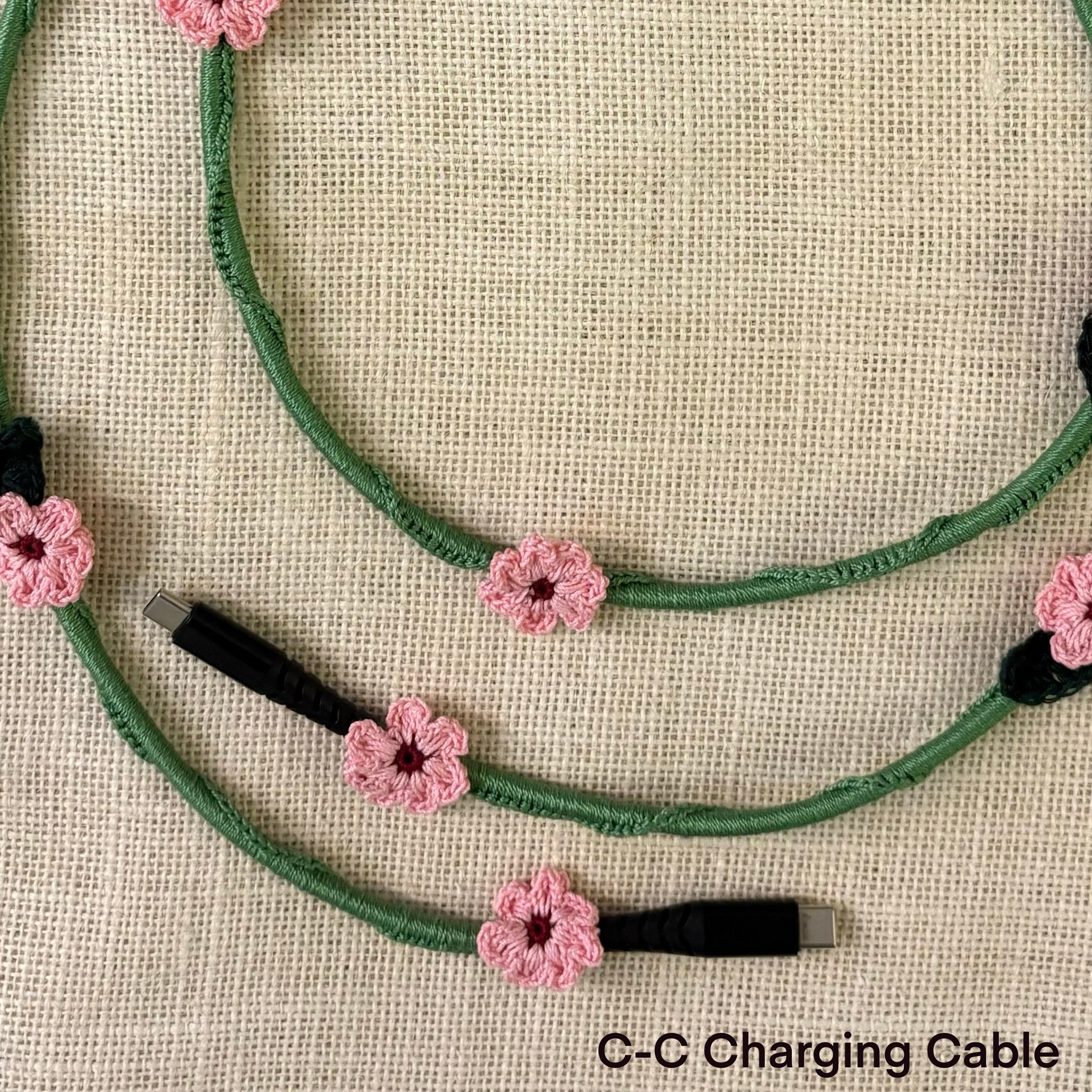Pink Daisy Crochet Charging Cord C-C Cable at Kamakhyaa by Ikriit'm. This item is Bloom by Ikriit'm, Crochet, Relaxed Fit, Under $50
