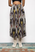 Pleated Midi Skirt at kamakhyaa.com by Anushé Pirani. This item is 100% Cotton, Beach Wear, Brunch Wear, Casual Wear, Console Collection List, Cotton, Fresh Ink by Anushe Pirani, Grey, Handwoven cotton, Ikat Prints, Regular Fit, Resort Wear, Vacation Wear, Womenswear