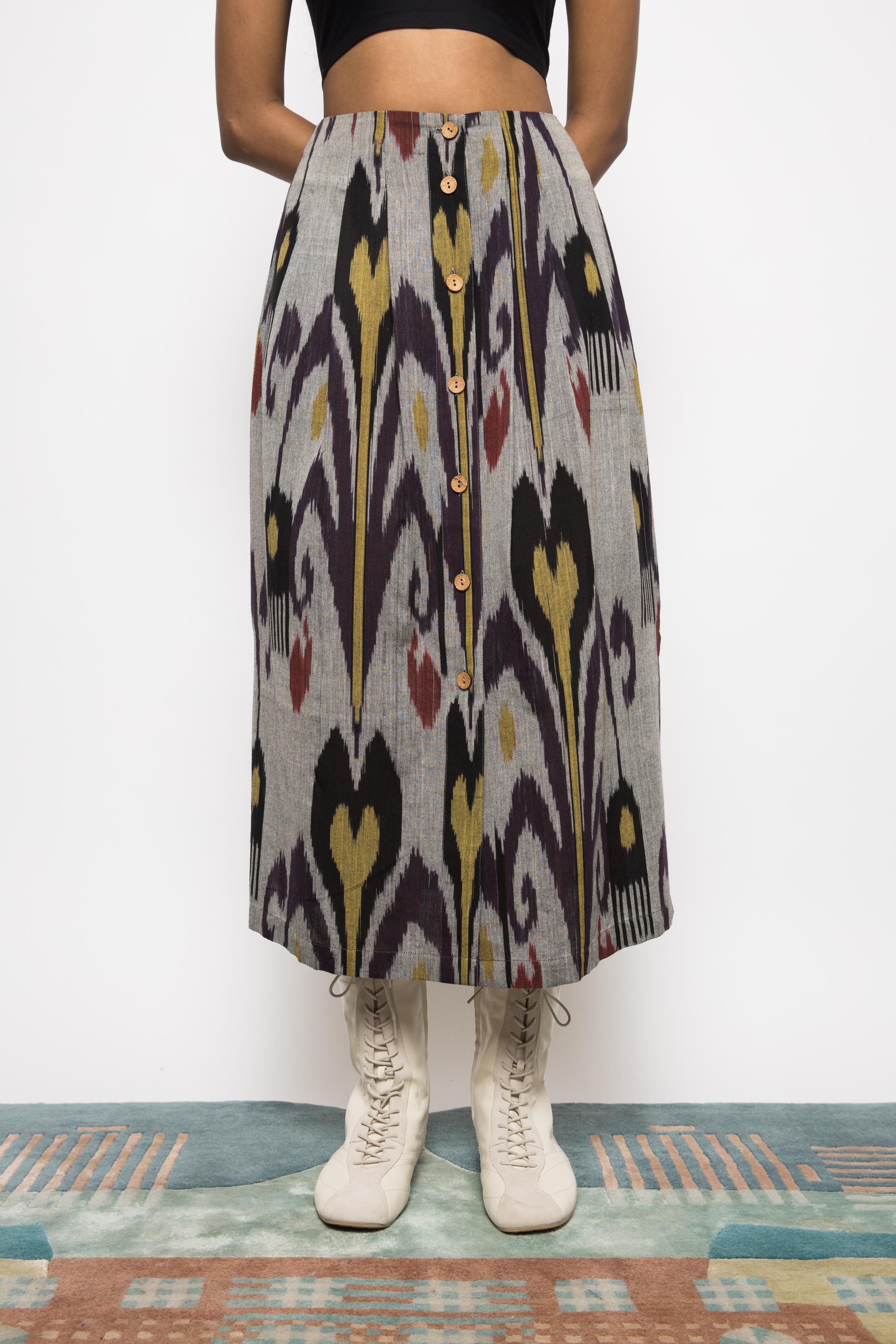 Pleated Midi Skirt at kamakhyaa.com by Anushé Pirani. This item is 100% Cotton, Beach Wear, Brunch Wear, Casual Wear, Console Collection List, Cotton, Fresh Ink by Anushe Pirani, Grey, Handwoven cotton, Ikat Prints, Regular Fit, Resort Wear, Vacation Wear, Womenswear