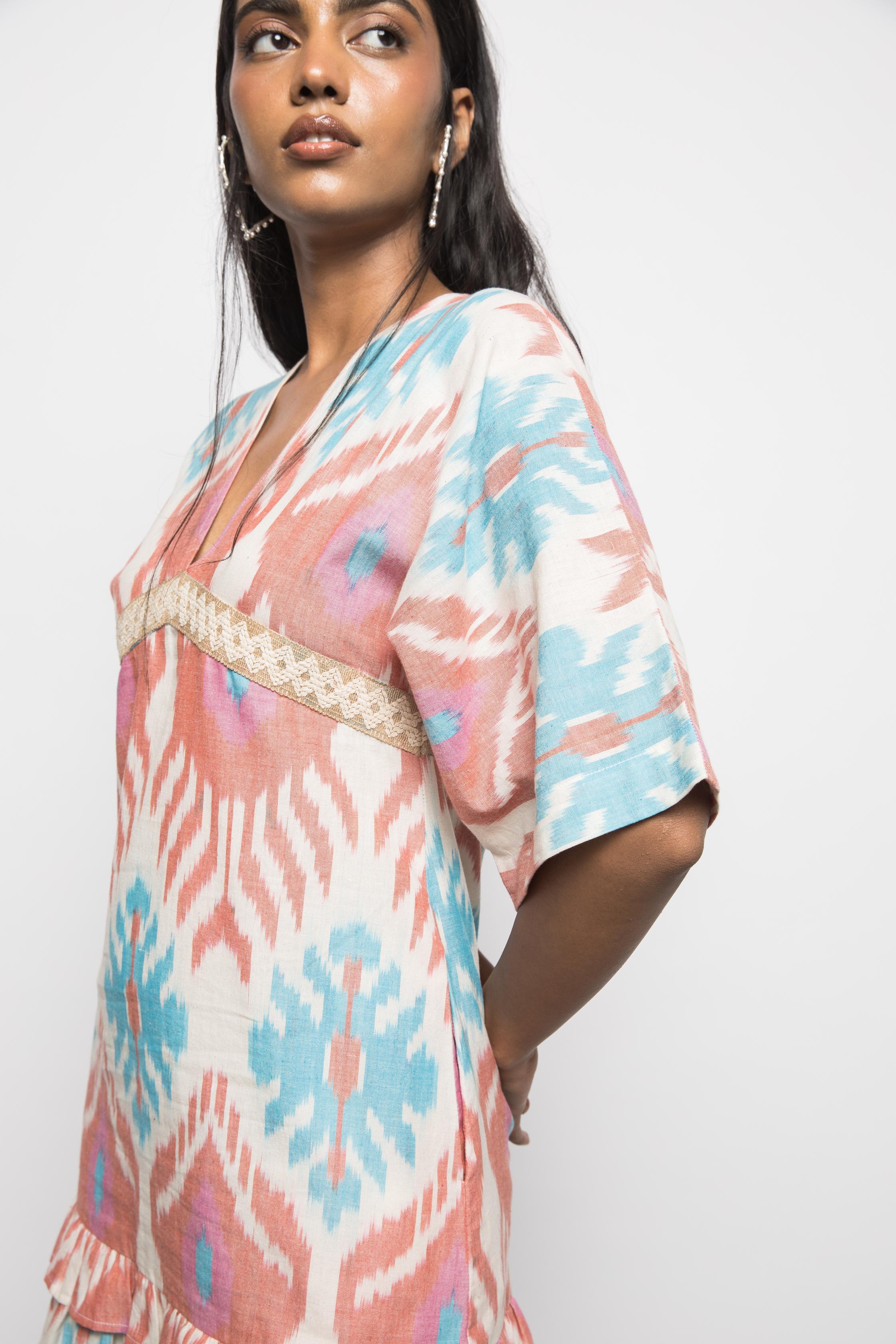 Plunge Neck Ruffle Mini at kamakhyaa.com by Anushé Pirani. This item is 100% Cotton, Beach Wear, Brunch Wear, Casual Wear, Console Collection List, Cotton, Fresh Ink by Anushe Pirani, Handwoven cotton, Ikat Prints, Multicolor, Party Wear, Regular Fit, Resort Wear, Vacation Wear, Womenswear
