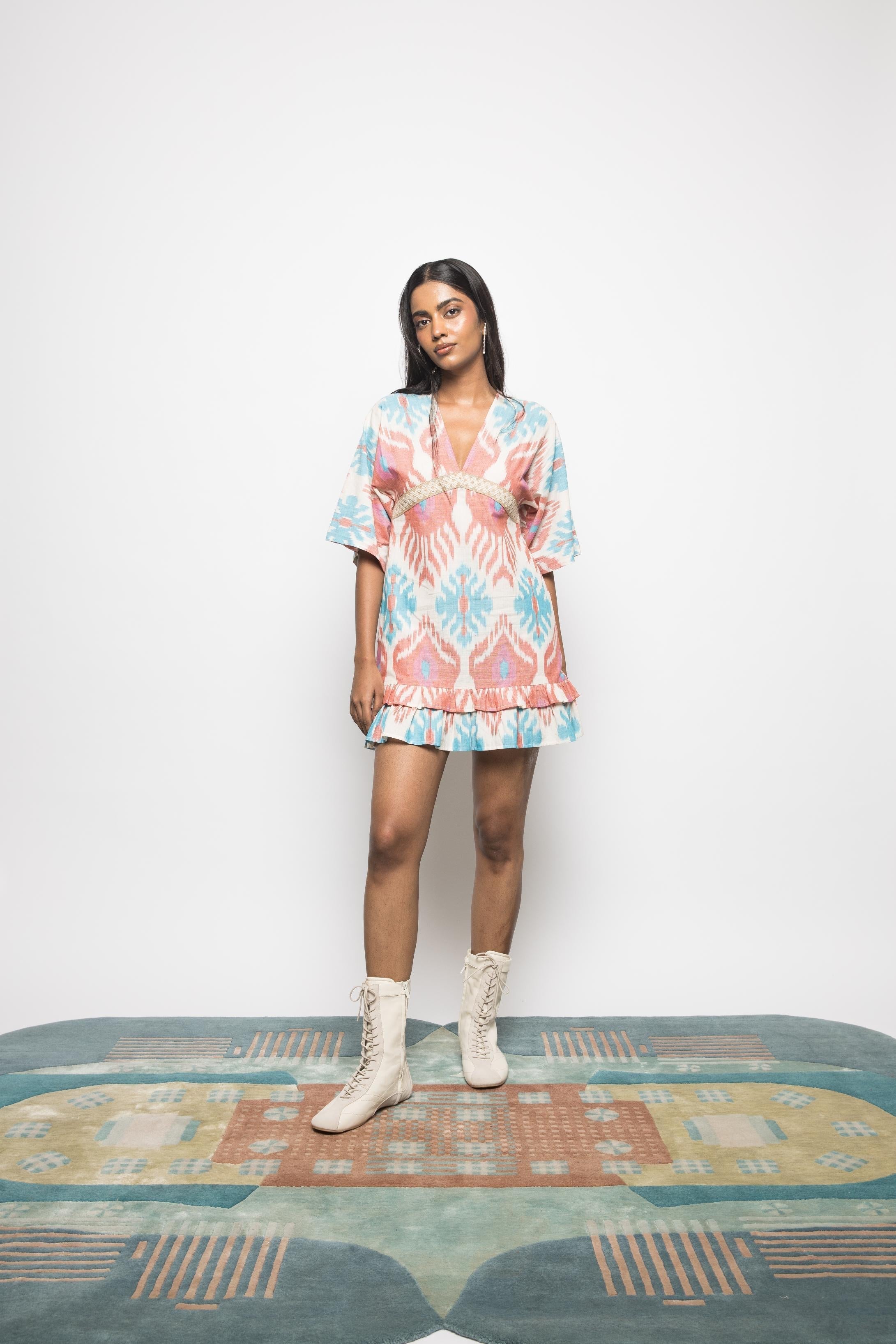 Plunge Neck Ruffle Mini at kamakhyaa.com by Anushé Pirani. This item is 100% Cotton, Beach Wear, Brunch Wear, Casual Wear, Console Collection List, Cotton, Fresh Ink by Anushe Pirani, Handwoven cotton, Ikat Prints, Multicolor, Party Wear, Regular Fit, Resort Wear, Vacation Wear, Womenswear