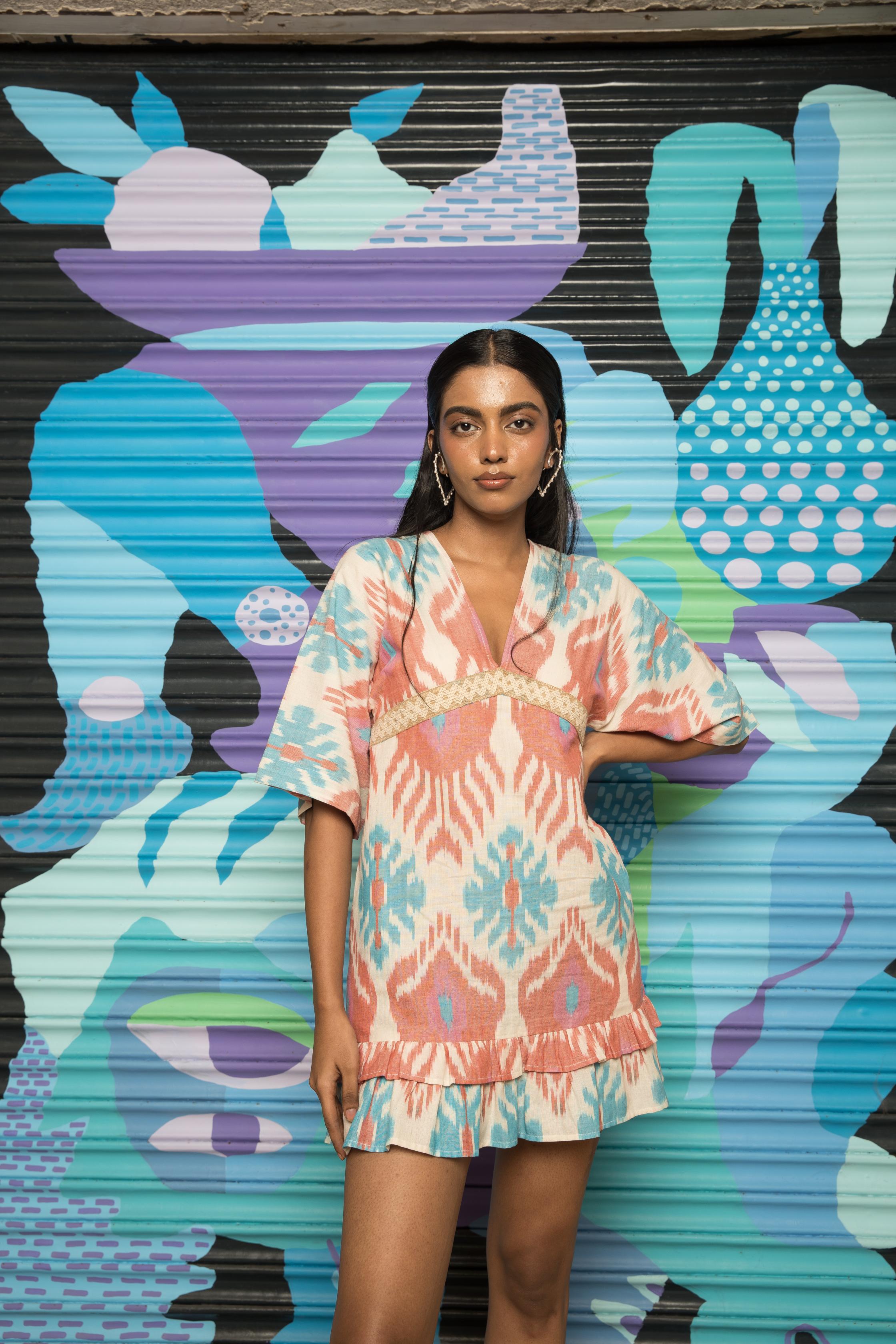 Plunge Neck Ruffle Mini at kamakhyaa.com by Anushé Pirani. This item is 100% Cotton, Beach Wear, Brunch Wear, Casual Wear, Console Collection List, Cotton, Fresh Ink by Anushe Pirani, Handwoven cotton, Ikat Prints, Multicolor, Party Wear, Regular Fit, Resort Wear, Vacation Wear, Womenswear