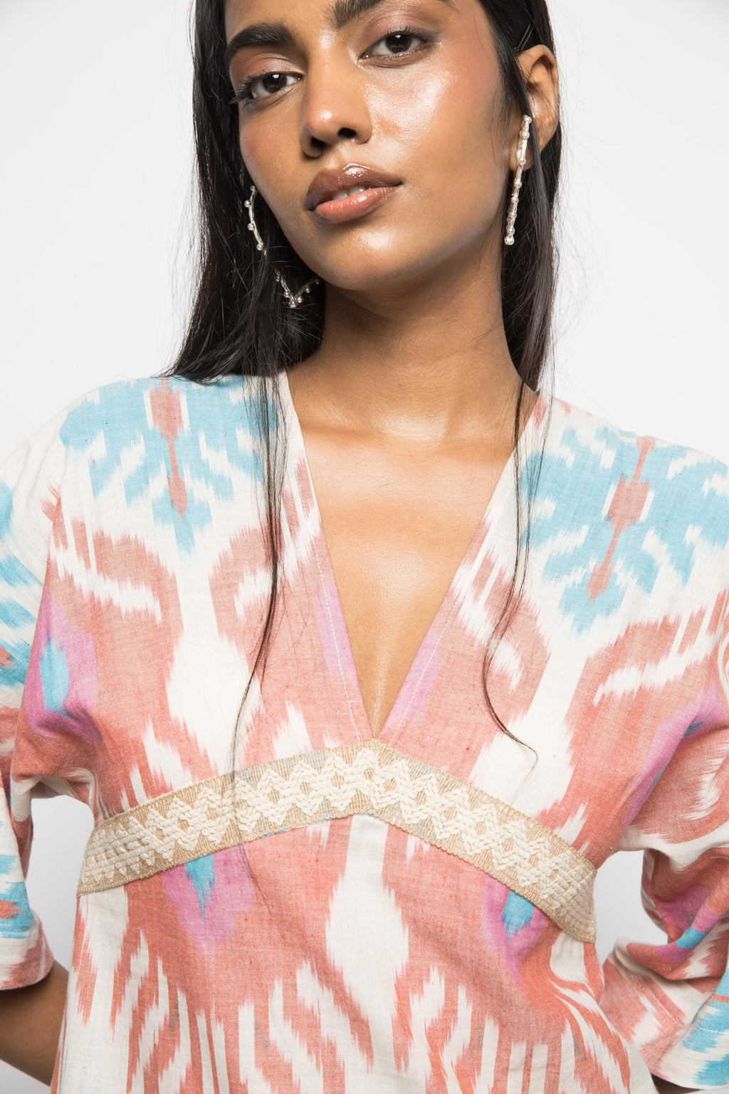 Plunge Neck Ruffle Mini at kamakhyaa.com by Anushé Pirani. This item is 100% Cotton, Beach Wear, Brunch Wear, Casual Wear, Console Collection List, Cotton, Fresh Ink by Anushe Pirani, Handwoven cotton, Ikat Prints, Multicolor, Party Wear, Regular Fit, Resort Wear, Vacation Wear, Womenswear