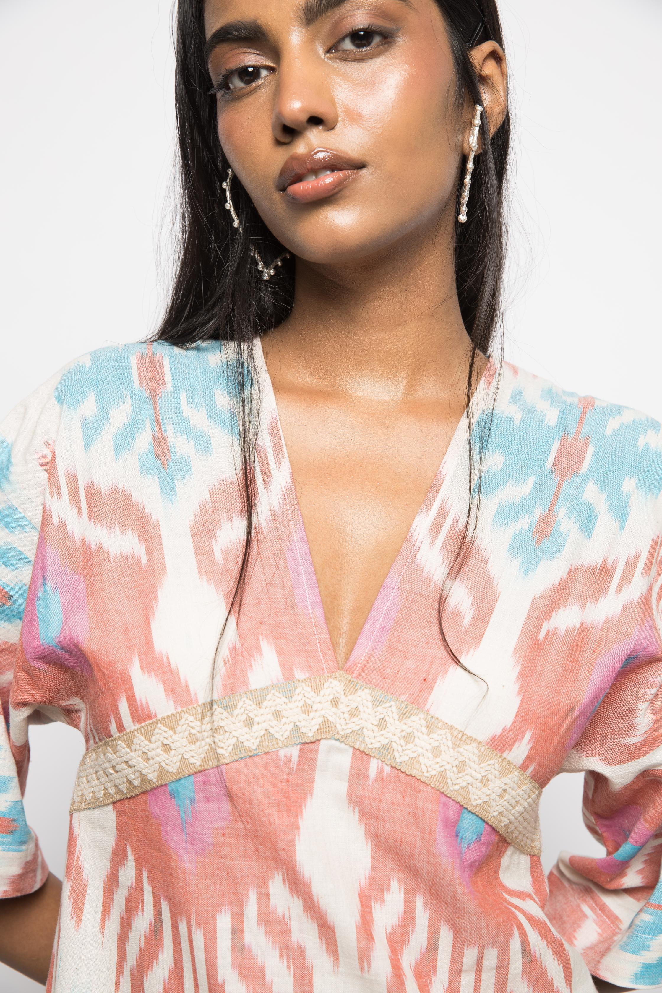 Plunge Neck Ruffle Mini at kamakhyaa.com by Anushé Pirani. This item is 100% Cotton, Beach Wear, Brunch Wear, Casual Wear, Console Collection List, Cotton, Fresh Ink by Anushe Pirani, Handwoven cotton, Ikat Prints, Multicolor, Party Wear, Regular Fit, Resort Wear, Vacation Wear, Womenswear
