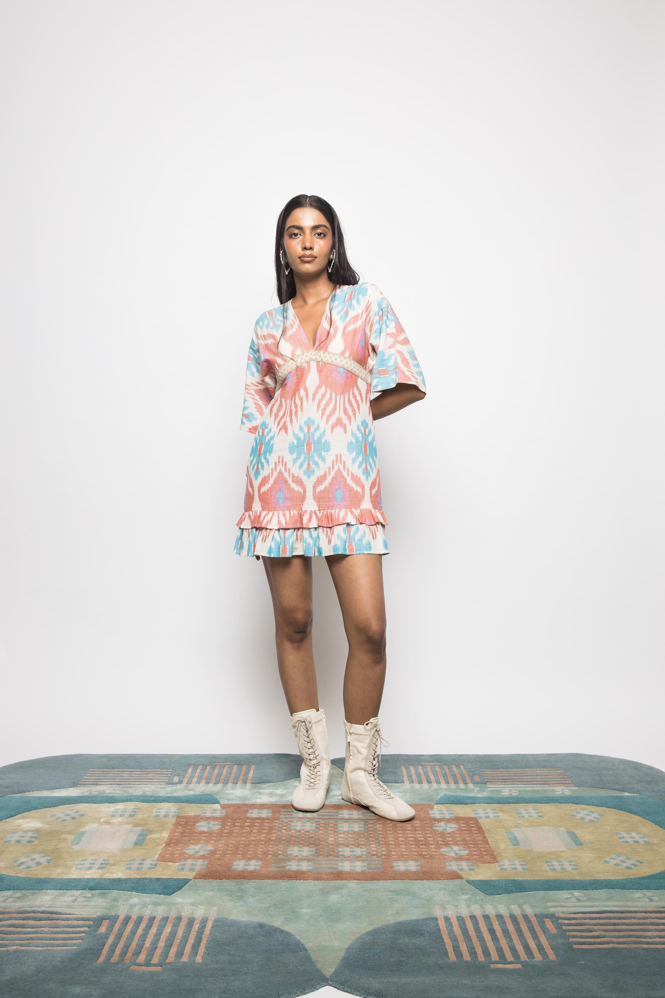 Plunge Neck Ruffle Mini at kamakhyaa.com by Anushé Pirani. This item is 100% Cotton, Beach Wear, Brunch Wear, Casual Wear, Console Collection List, Cotton, Fresh Ink by Anushe Pirani, Handwoven cotton, Ikat Prints, Multicolor, Party Wear, Regular Fit, Resort Wear, Vacation Wear, Womenswear