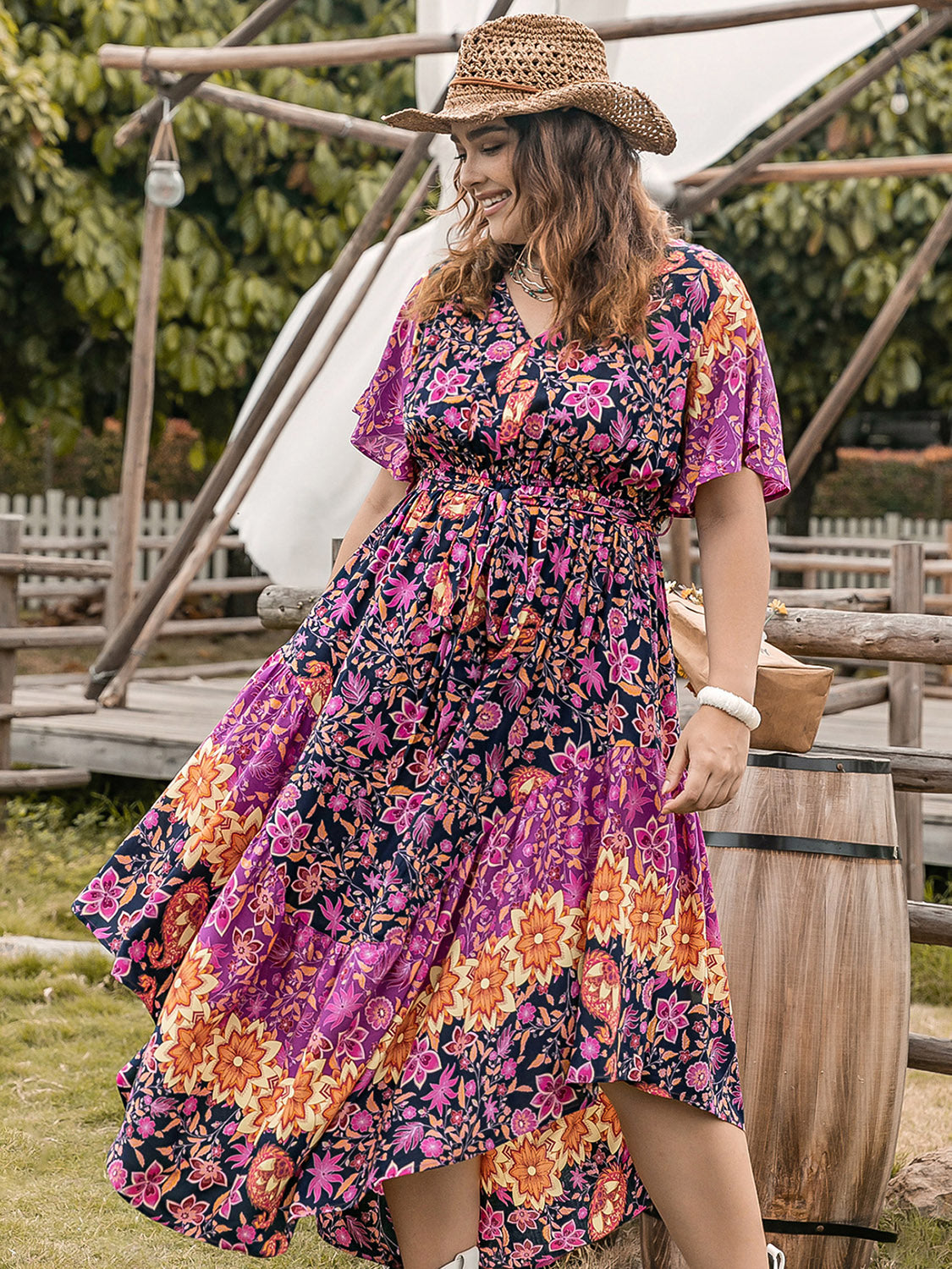 Plus Size Printed V-Neck Flutter Sleeve Midi Dress at Kamakhyaa by Trendsi. This item is H.R.Z, Ship From Overseas, Trendsi