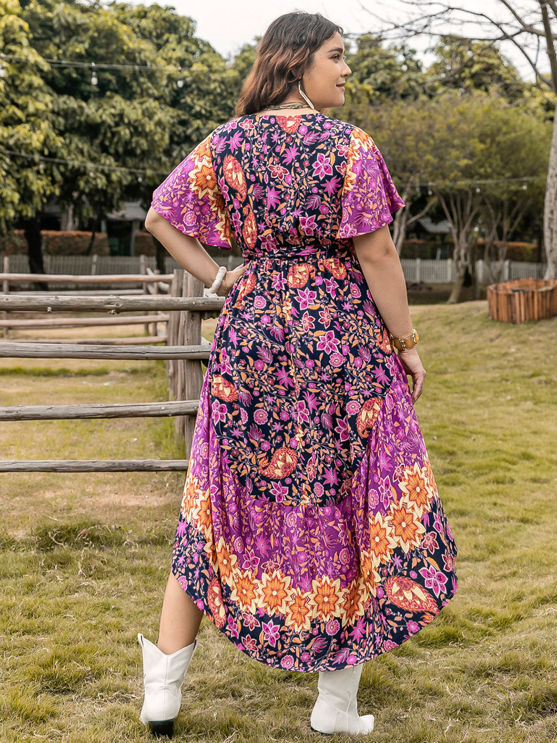 Plus Size Printed V-Neck Flutter Sleeve Midi Dress at Kamakhyaa by Trendsi. This item is H.R.Z, Ship From Overseas, Trendsi