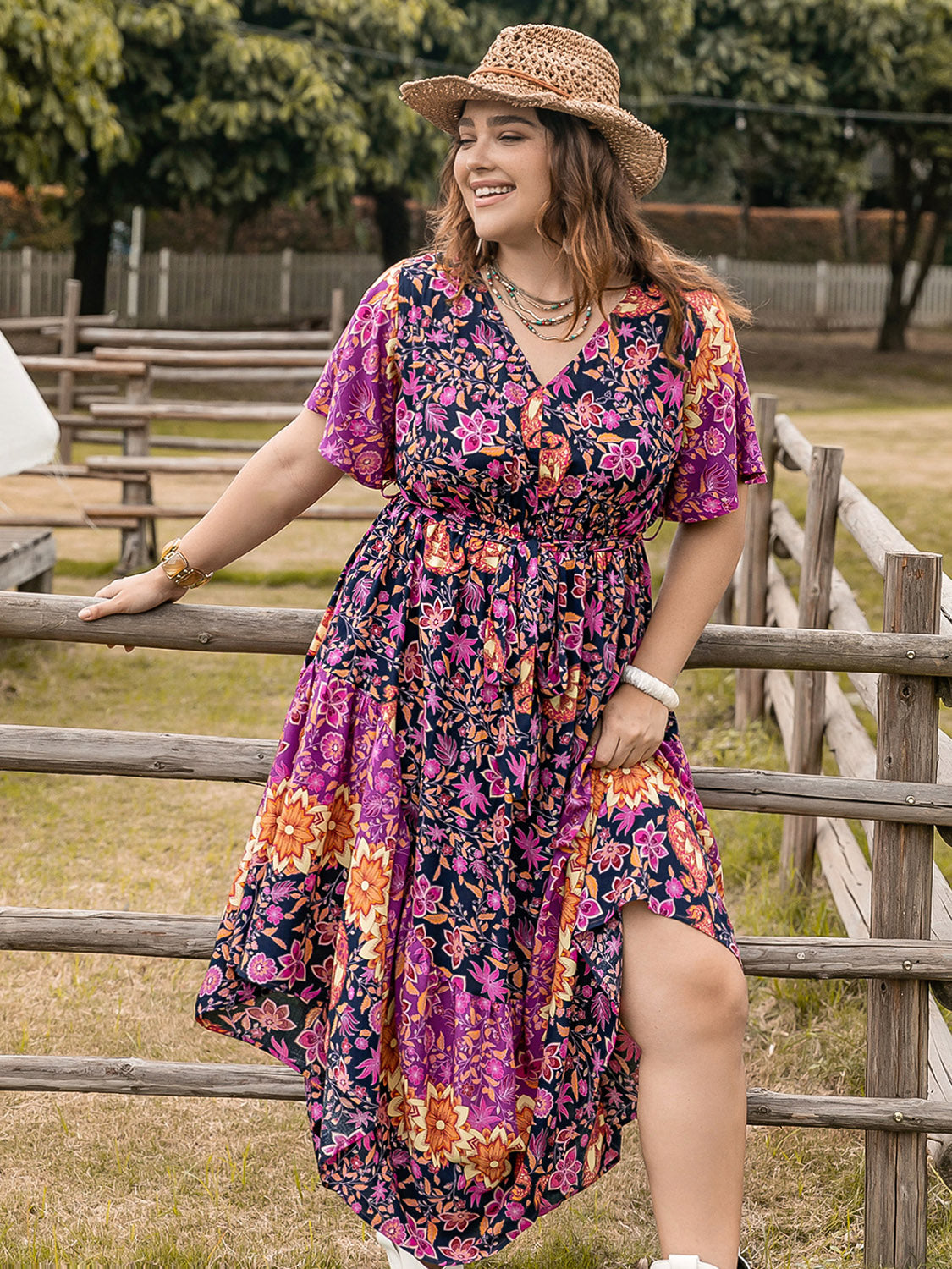 Plus Size Printed V-Neck Flutter Sleeve Midi Dress at Kamakhyaa by Trendsi. This item is H.R.Z, Ship From Overseas, Trendsi