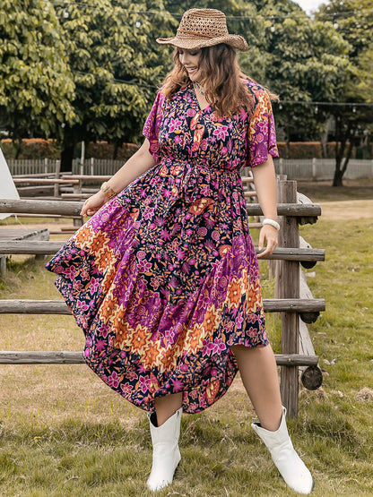 Plus Size Printed V-Neck Flutter Sleeve Midi Dress at Kamakhyaa by Trendsi. This item is H.R.Z, Ship From Overseas, Trendsi