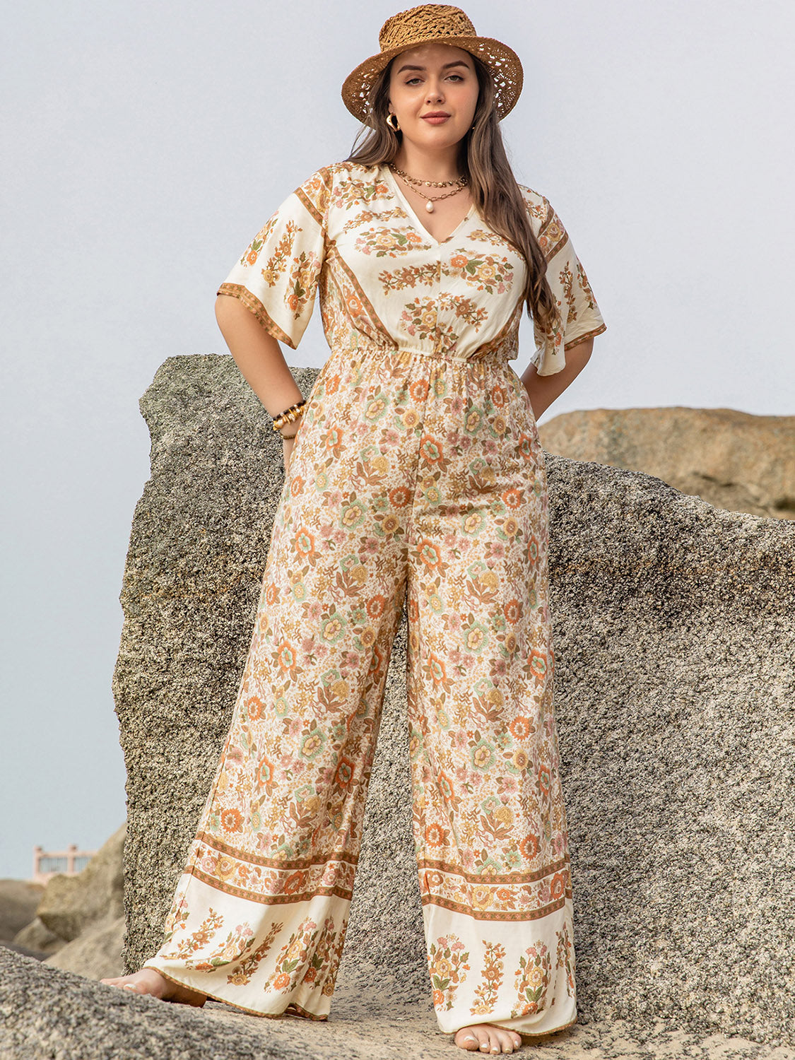 Plus Size V-Neck Flutter Sleeve Wide Leg Jumpsuit at Kamakhyaa by Trendsi. This item is H.R.Z, Ship From Overseas, Trendsi