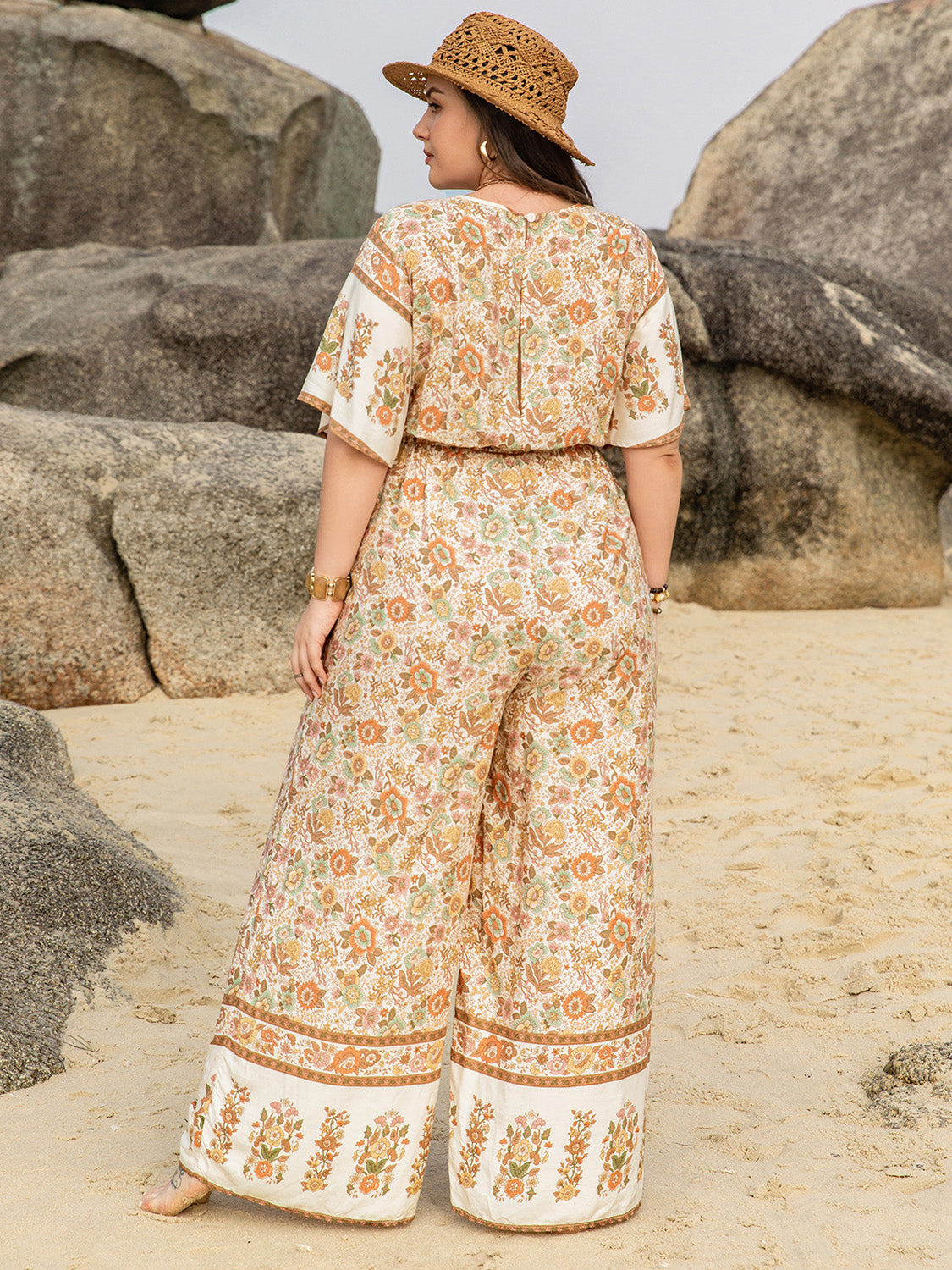 Plus Size V-Neck Flutter Sleeve Wide Leg Jumpsuit at Kamakhyaa by Trendsi. This item is H.R.Z, Ship From Overseas, Trendsi