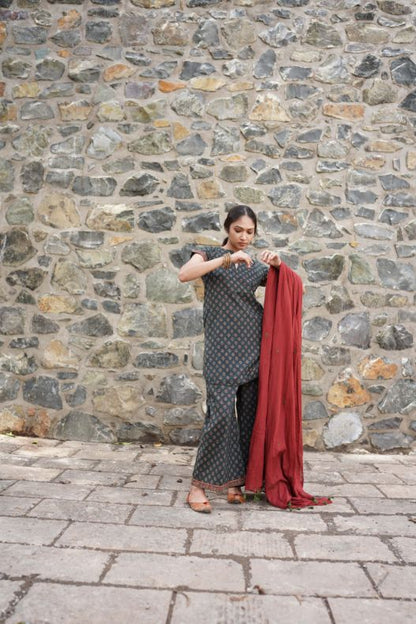 Printed Green Kurta Set with Red Dupatta at Kamakhyaa by Hasttvam. This item is CottonFloralFestive WearGreenHandmade by artisans, Natural dyes, Relaxed Fit, Respondible production and Vegan