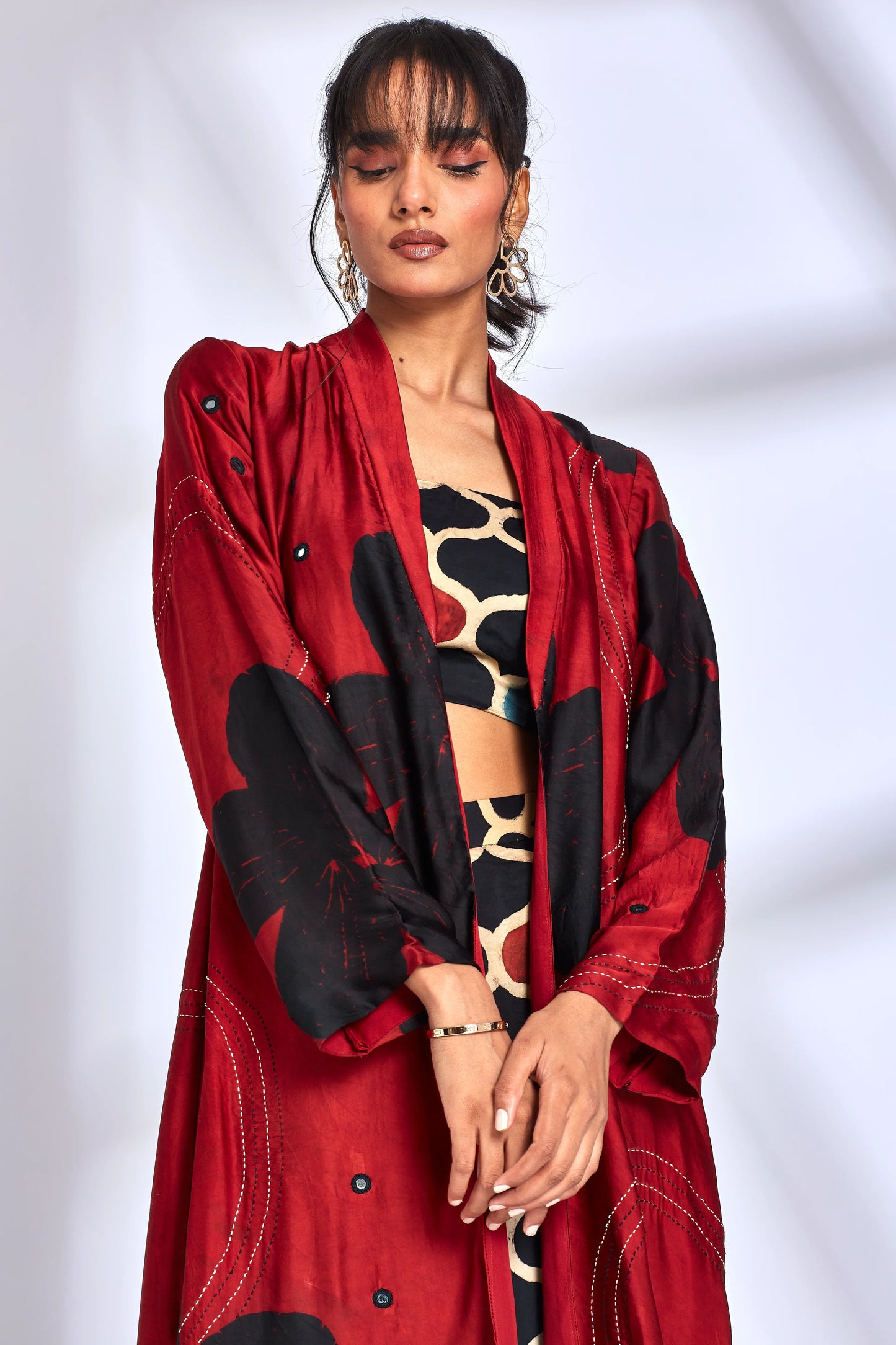 Printed Red Long Jacket at Kamakhyaa by Hasttvam. This item is ModalFloralFusionBlackHandmade by artisans, Natural dyes, Relaxed Fit, Respondible production and Vegan