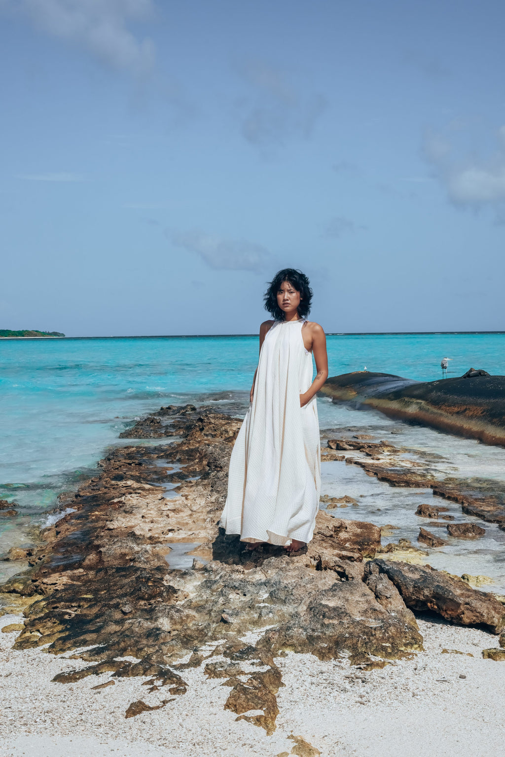 Recycled Cotton Off-White Sleeveless Dress at Kamakhyaa by Raas. This item is Azo Free Dyes, Cotton, Halter Neck Dresses, Layla, Maxi Dresses, Off-White, Recycled, Relaxed Fit, Resort Wear, Sleeveless Dresses, Solids, Womenswear