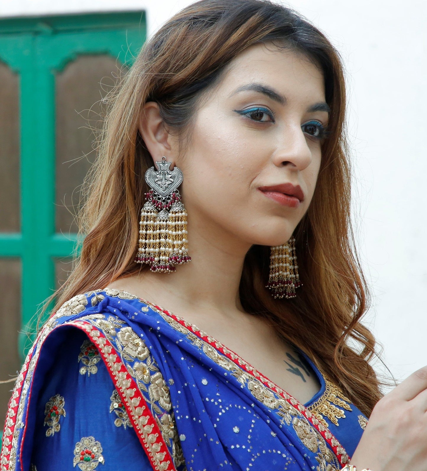 Red Jhumkas Genda Ladi at Kamakhyaa by House Of Heer. This item is Alloy Metal, Festive Jewellery, Festive Wear, Free Size, jewelry, July Sale, July Sale 2023, Long Earrings, Pearl, Red, Solids, Textured