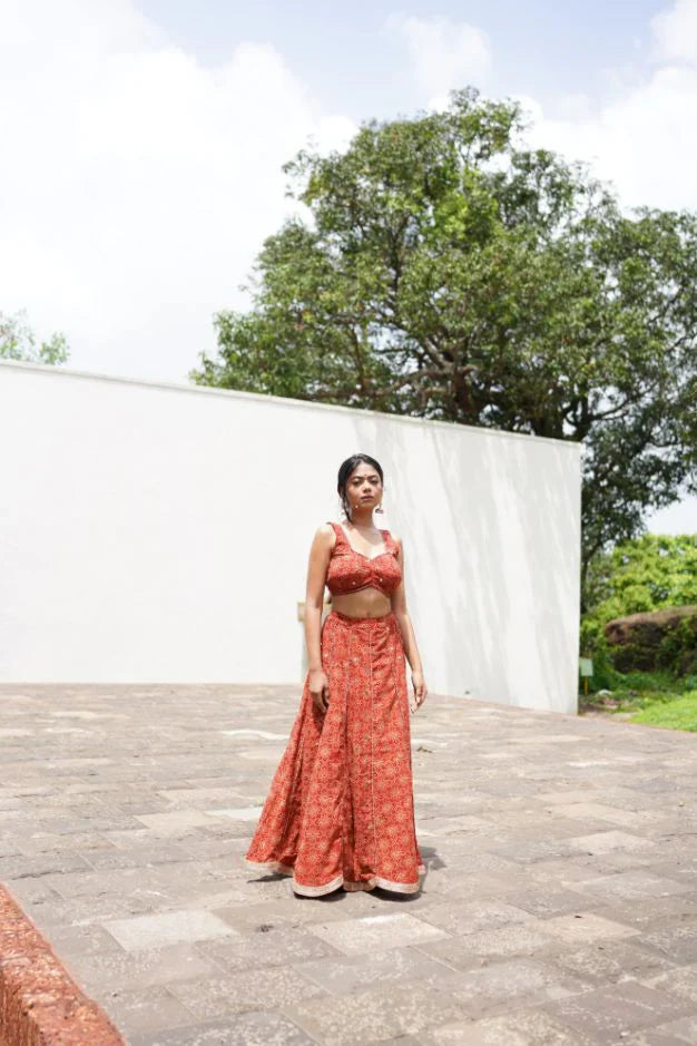 Red Lehenga Set at Kamakhyaa by Hasttvam. This item is CottonFloralFestive WearRedHandmade by artisans, Natural dyes, Relaxed Fit, Respondible production and Vegan