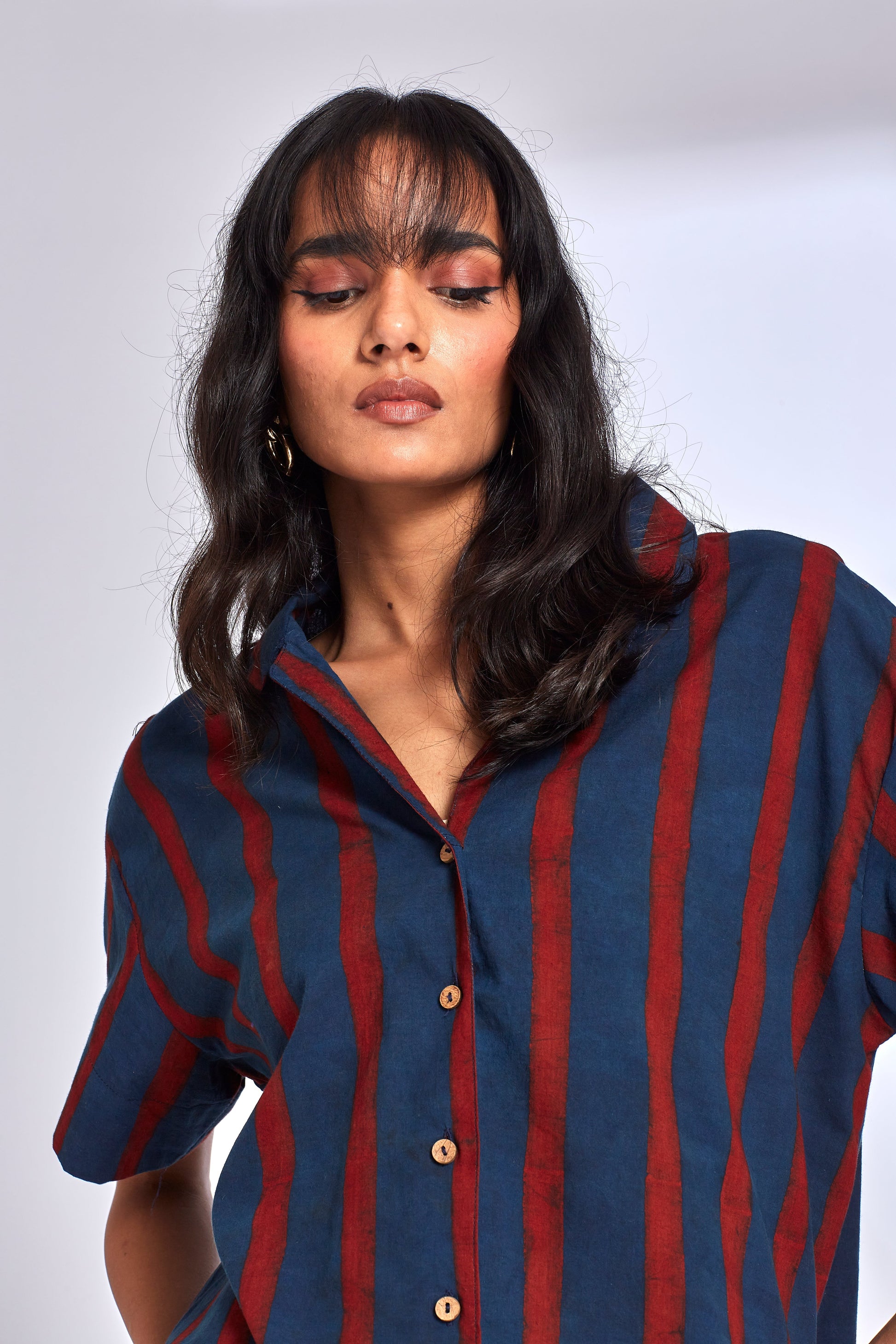 Red Striped Indigo Shirt at Kamakhyaa by Hasttvam. This item is Cotton, Fusion Wear, Handmade by Artisans, Indigo, Natural dyes, Relaxed Fit, Respondible production and Vegan, Stripes