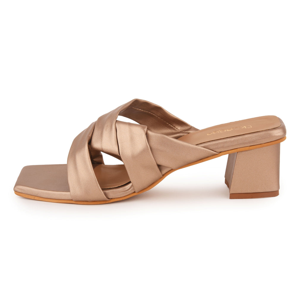 Rose Gold Metallic Party Heels at Kamakhyaa by EK_agga. This item is Cocktail Wedding, Diwali 2024, Evening Errands, Evening Special Footwear, Farewell Party, Gold, Heels, Iconic Threads of Emily Cooper, Iconic Threads of Margot Robbie, Less than $50, Metallic, Paris, Party Wear, Patent leather, Red, Regular Fit, Santorini, Solids, Square Toe Footwear, Vacation Wear, Vegan