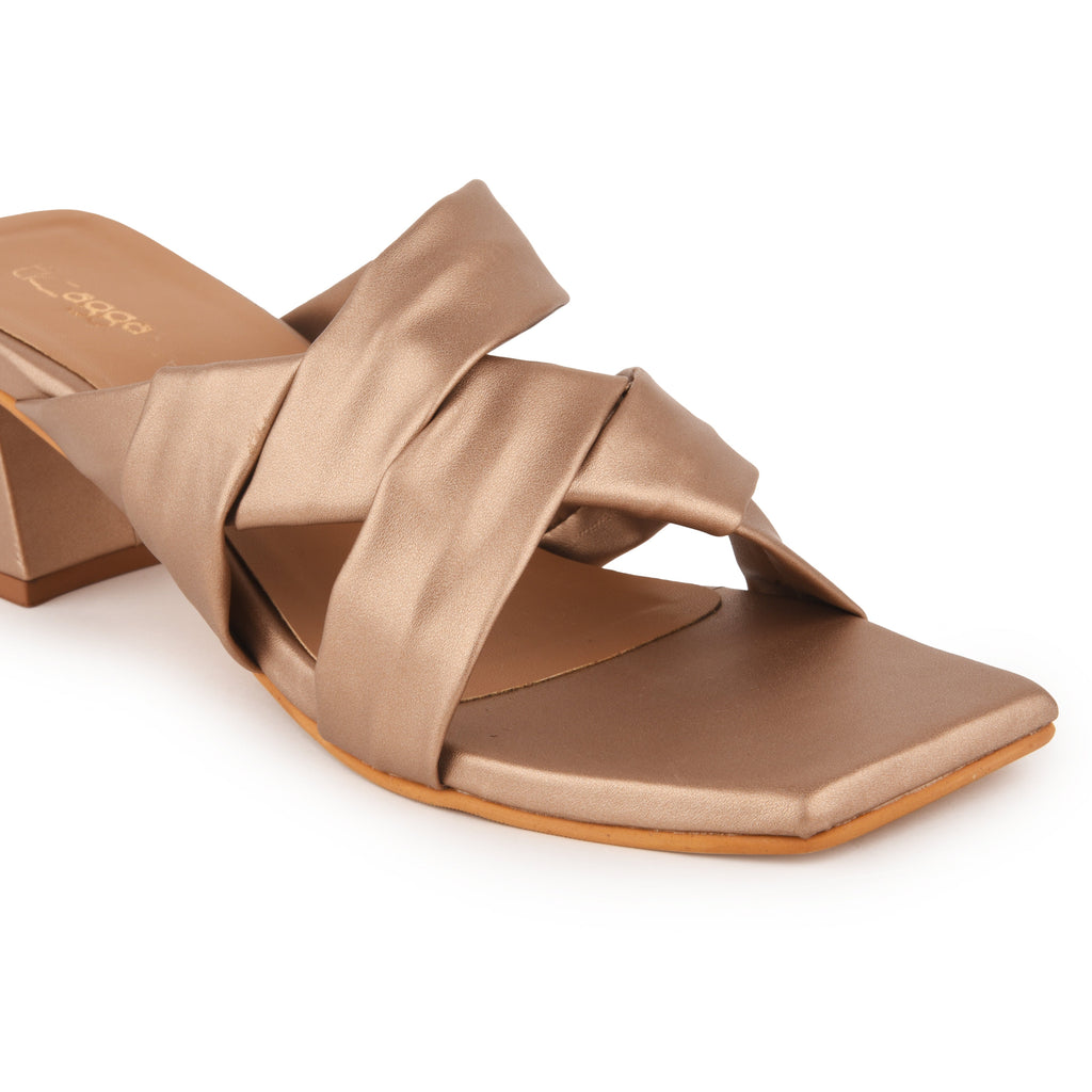 Rose Gold Metallic Party Heels at Kamakhyaa by EK_agga. This item is Cocktail Wedding, Diwali 2024, Evening Errands, Evening Special Footwear, Farewell Party, Gold, Heels, Iconic Threads of Emily Cooper, Iconic Threads of Margot Robbie, Less than $50, Metallic, Paris, Party Wear, Patent leather, Red, Regular Fit, Santorini, Solids, Square Toe Footwear, Vacation Wear, Vegan