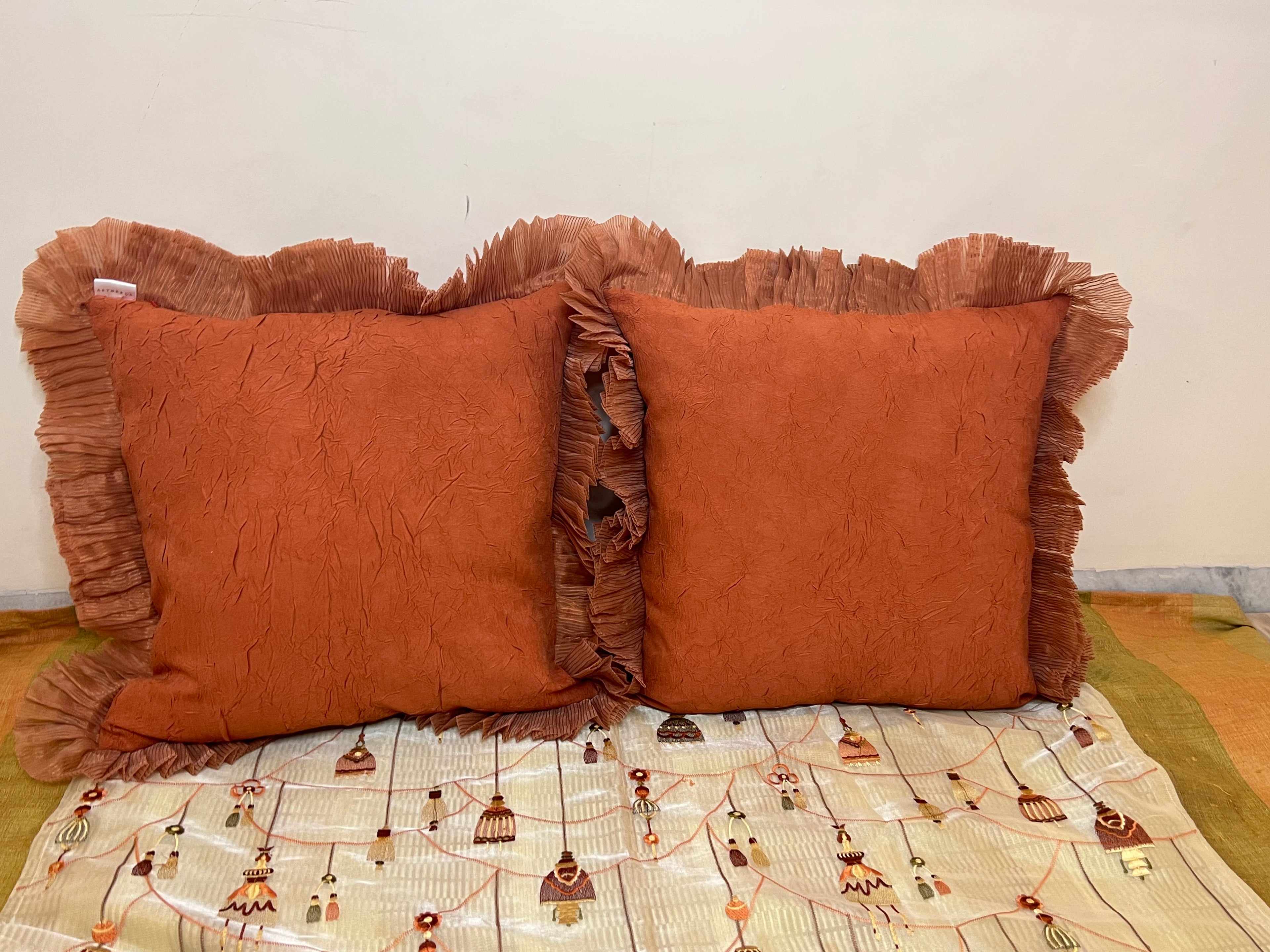 Rustic Ruffle Cushion Cover Sets at Kamakhyaa by Aetherea. This item is Cotton, Cushion, Cushion covers, Home, Orange, Plain, Ruffles, Solid, Upcycled