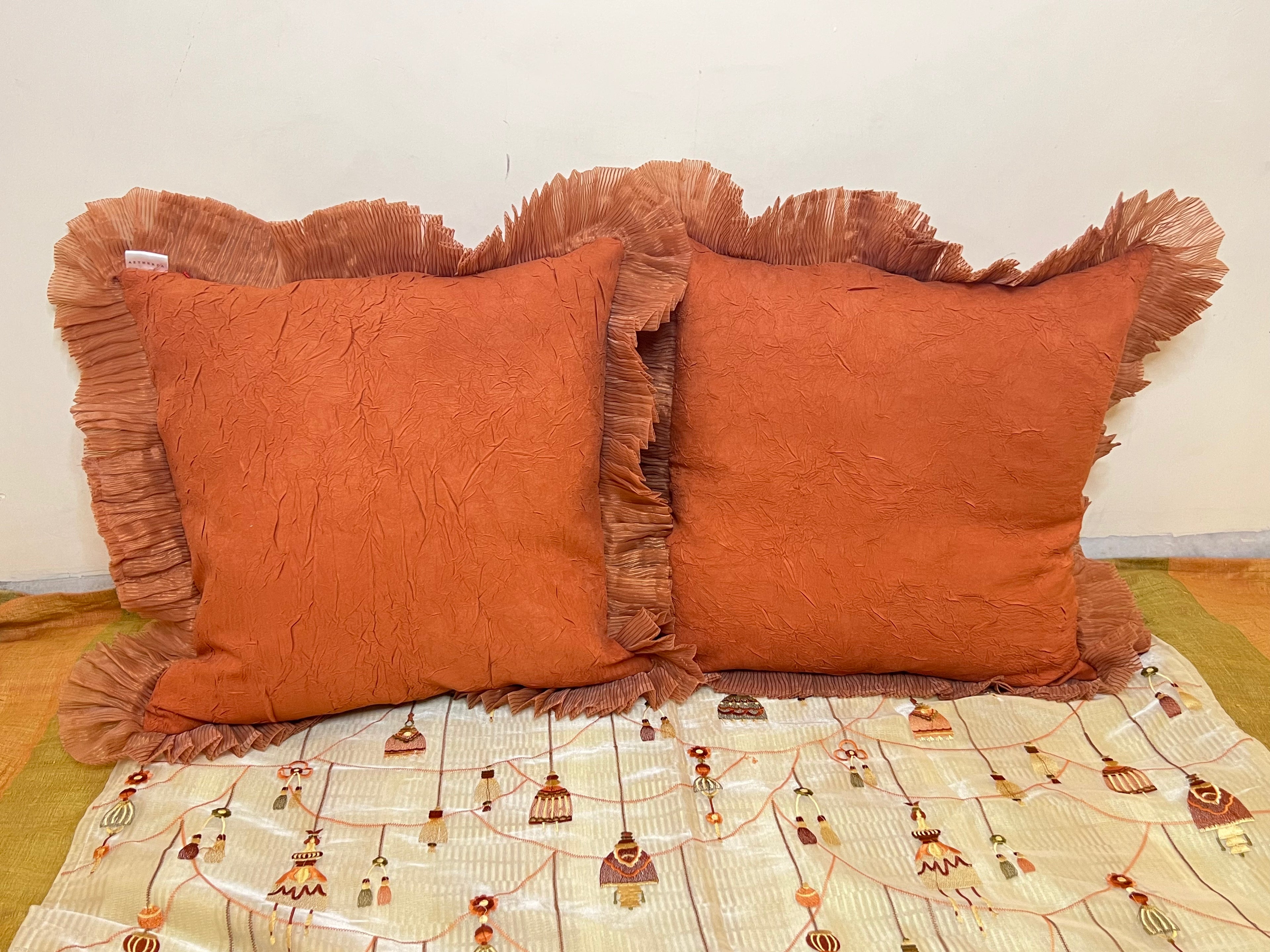 Rustic Ruffle Cushion Cover Sets at Kamakhyaa by Aetherea. This item is Cotton, Cushion, Cushion covers, Home, Orange, Plain, Ruffles, Solid, Upcycled