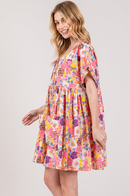 SAGE + FIG Floral Short Sleeve Babydoll Dress with Pockets at Kamakhyaa by Trendsi. This item is SAGE+FIG, Ship from USA, Trendsi