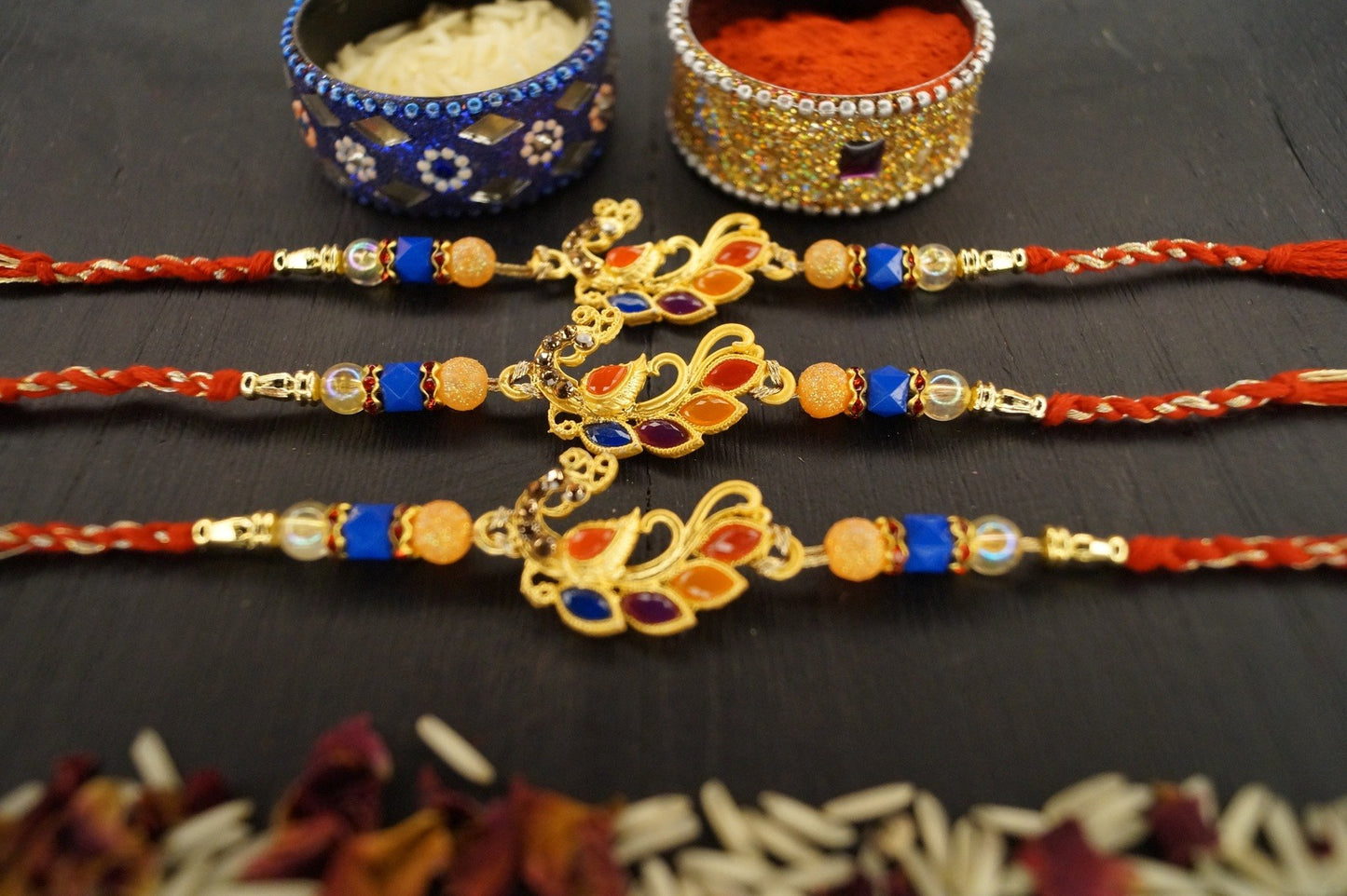 Set of 3-Peacock Colorful Stone Thread Rakhi at Kamakhyaa by Kamakhyaa. This item is jewelry, Multicolor, Natural, Rakhi, Under 1500, Under 1750, Upcycled