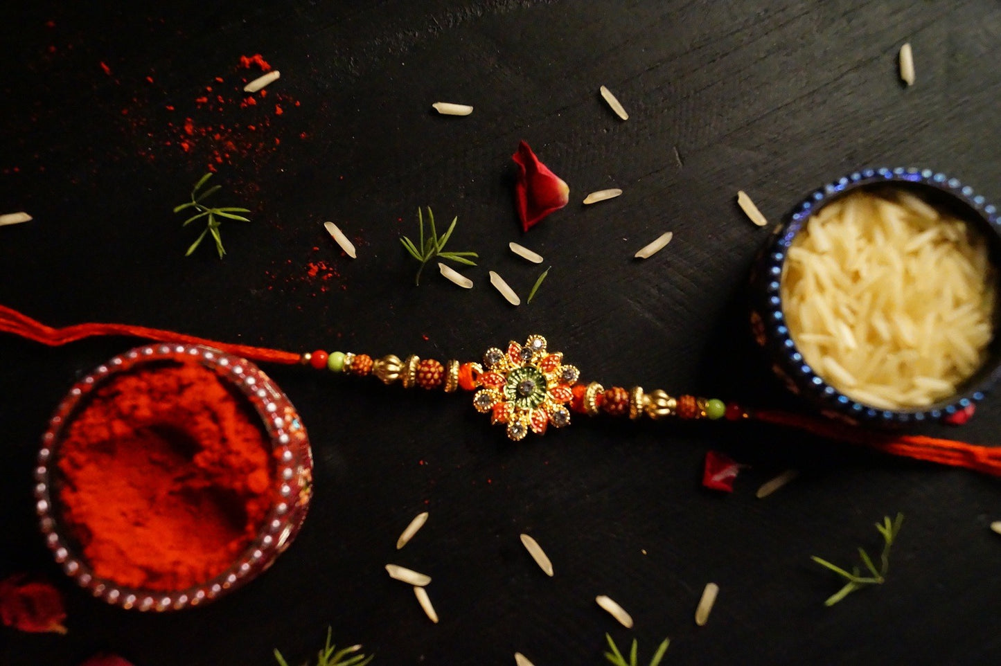 Set of 5-Floral Rudraksh Thread Rakhi at Kamakhyaa by Kamakhyaa. This item is jewelry, Natural, Rakhi, Red, Upcycled