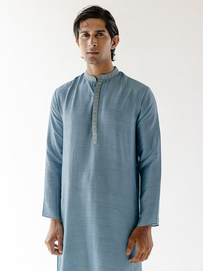 Solid Blue Cotton Silk Kurta Set at Kamakhyaa by RoohbyRidhimaa. This item is 100% pure cotton, Blue, Cotton Silk, Festive Wear, Kurta Pant Sets, Men Kurta Pant Sets, Menswear By RoohbyRidhimaa, Qala By RoohbyRidhimaa, Regular Fit, Solids, Viscose Raw Silk