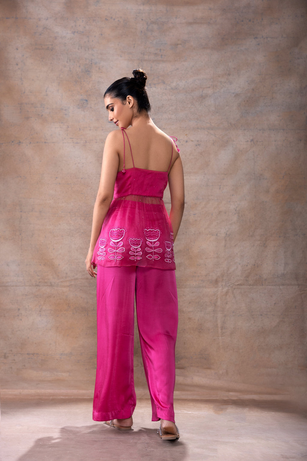 Tie-Up Peplum Tunic and Pant Set at Kamakhyaa by Akashi Clothing. This item is Co-ord Sets, Evening Wear, Festive Wear, Fusion Wear, Hand Embroidered, missing, Modal Satin, Organza, Party Wear, Party Wear Co-ord Sets, Pink, Relaxed Fit, Resort Wear, Wedding Wear, Womenswear, Zaira by Akashi Clothing
