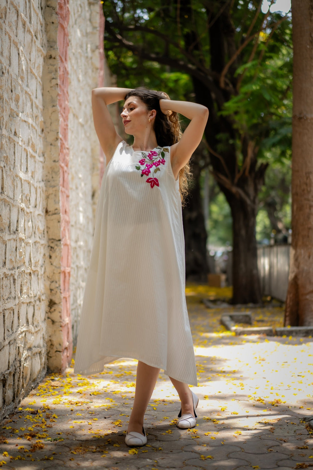 White A-line Dress with Floral Hand-Embroidery at Kamakhyaa by Krushnachuda. This item is Chilika by Krushnachuda, Embroidered, Handloom Cotton, Loose Fit, Natural Dye, Organic, Outerwear, Under $200, White, Womenswear
