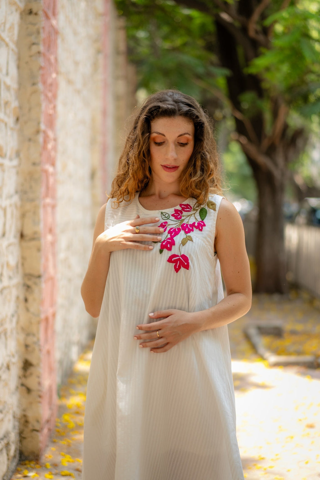 White A-line Dress with Floral Hand-Embroidery at Kamakhyaa by Krushnachuda. This item is Chilika by Krushnachuda, Embroidered, Handloom Cotton, Loose Fit, Natural Dye, Organic, Outerwear, Under $200, White, Womenswear