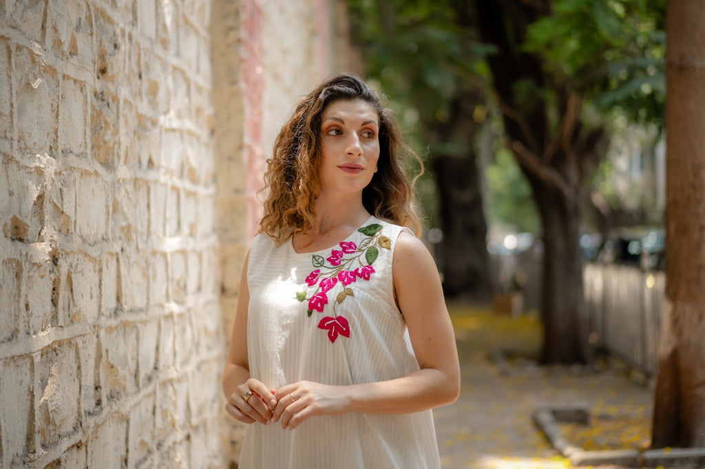 White A-line Dress with Floral Hand-Embroidery at Kamakhyaa by Krushnachuda. This item is Chilika by Krushnachuda, Embroidered, Handloom Cotton, Loose Fit, Natural Dye, Organic, Outerwear, Under $200, White, Womenswear