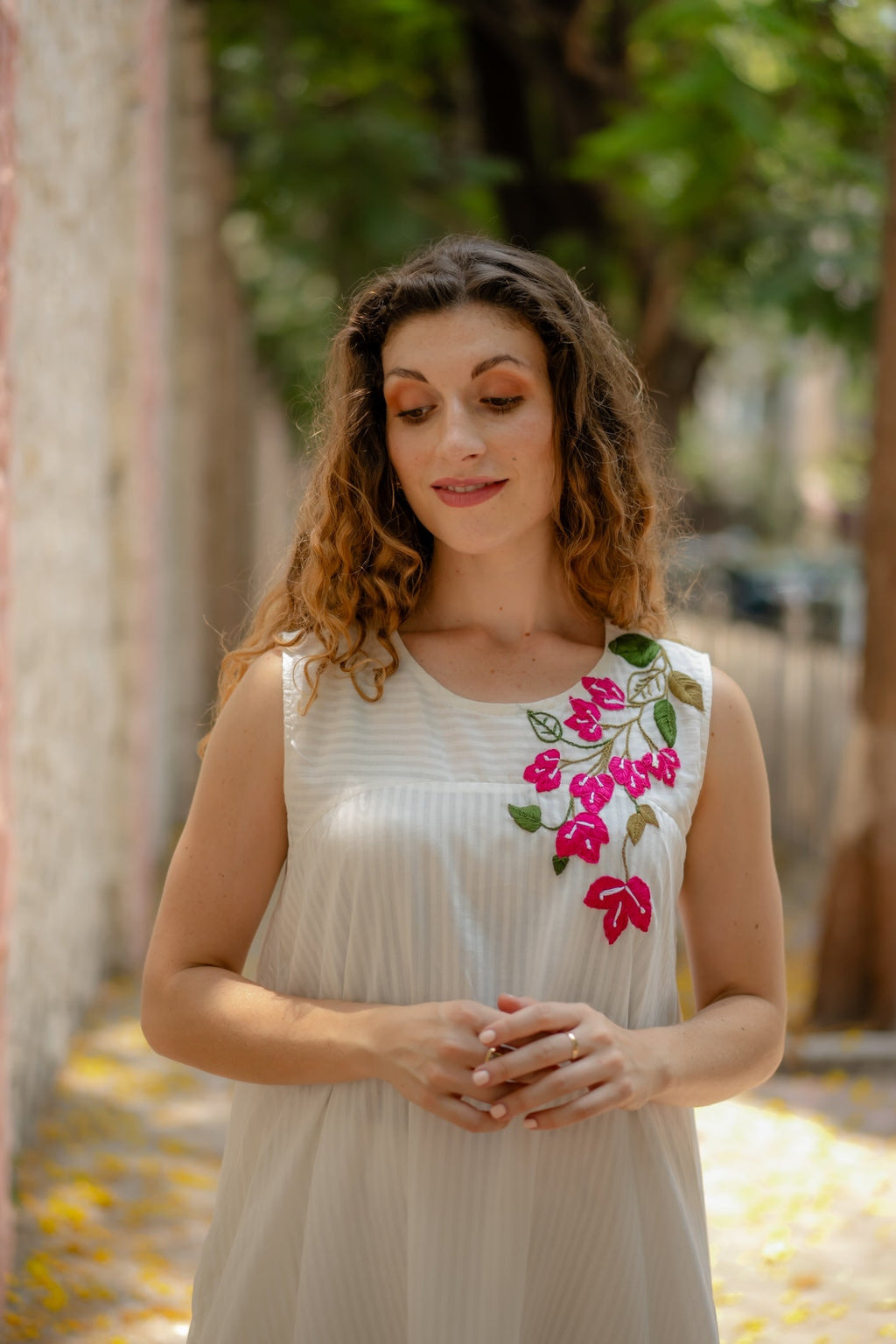 White A-line Dress with Floral Hand-Embroidery at Kamakhyaa by Krushnachuda. This item is Chilika by Krushnachuda, Embroidered, Handloom Cotton, Loose Fit, Natural Dye, Organic, Outerwear, Under $200, White, Womenswear
