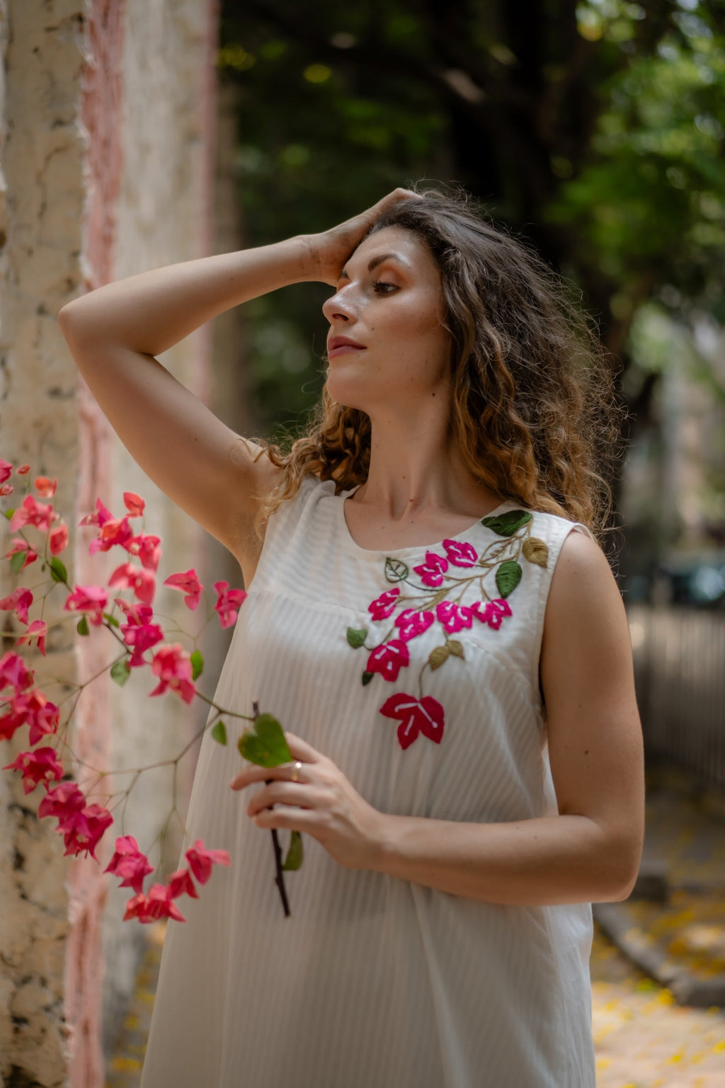 White A-line Dress with Floral Hand-Embroidery at Kamakhyaa by Krushnachuda. This item is Chilika by Krushnachuda, Embroidered, Handloom Cotton, Loose Fit, Natural Dye, Organic, Outerwear, Under $200, White, Womenswear