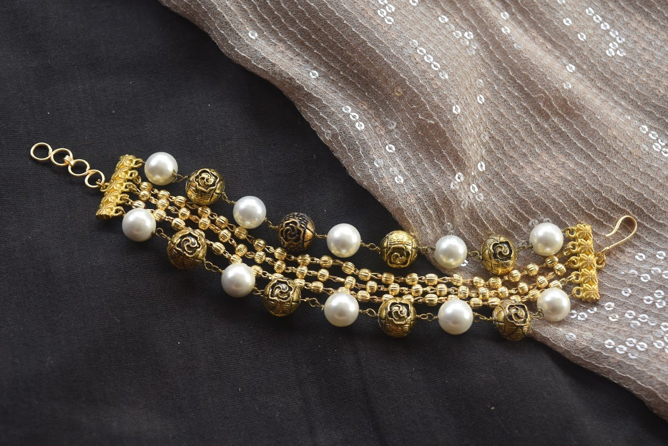 White Bracelet Suvarna at Kamakhyaa by House Of Heer. This item is Add Ons, Alloy Metal, Beaded Jewellery, Bracelets, Festive Jewellery, Festive Wear, Free Size, jewelry, July Sale, July Sale 2023, Less than $50, Natural, Pearl, Textured, White