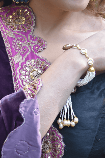 White Bracelet Varuni Tassel at Kamakhyaa by House Of Heer. This item is Add Ons, Alloy Metal, Bracelets, Festive Jewellery, Festive Wear, Free Size, jewelry, July Sale, July Sale 2023, Less than $50, Natural, Pearl, Polkis, Textured, White