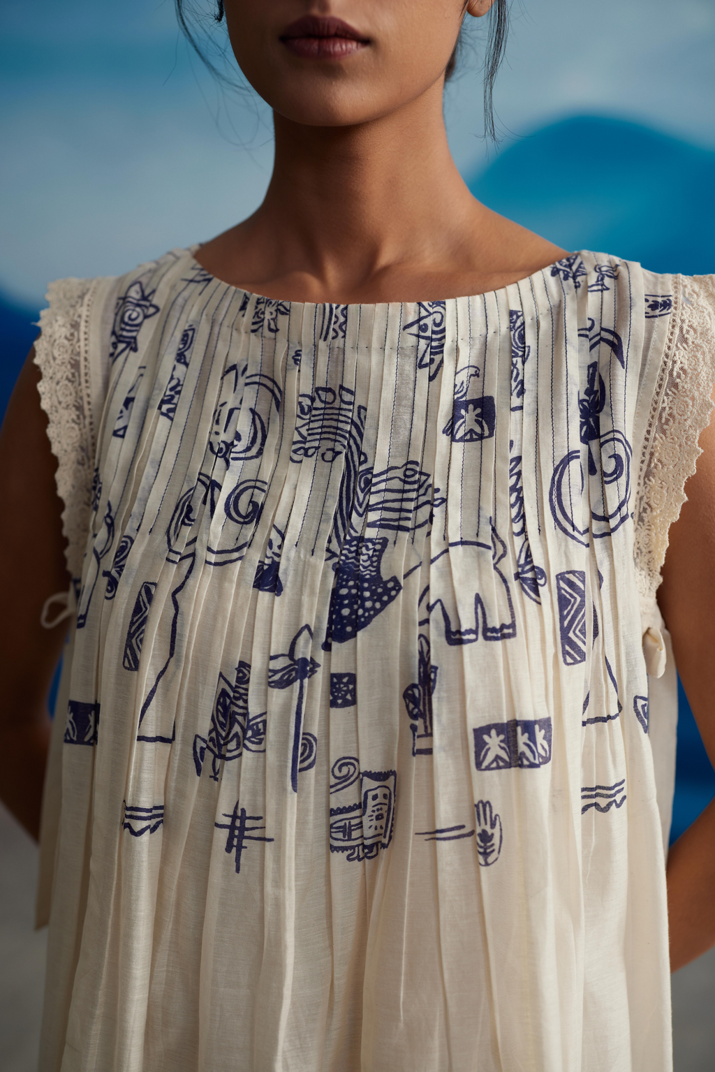 White Chanderi Pleated Midi Dress With Bow Tie-Up at Kamakhyaa by Ahmev. This item is Casual Wear, Chanderi, Indigo Eden by Ahmev, Korean Chic, Lace, Midi Dresses, Natural, Prints, Regular Fit, White, Womenswear