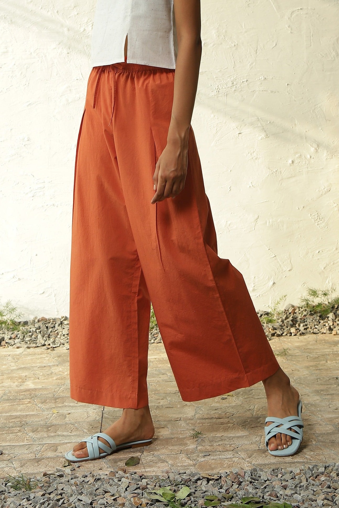 White Cotton Front Slit Top With Orange Palazzo Co-Ord Set at Kamakhyaa by Canoopi. This item is Canoopi, Casual Wear, Complete Sets, Khadi, Natural, Orange, Poplin, Regular Fit, Solids, Vacation Co-ords, White, Womenswear