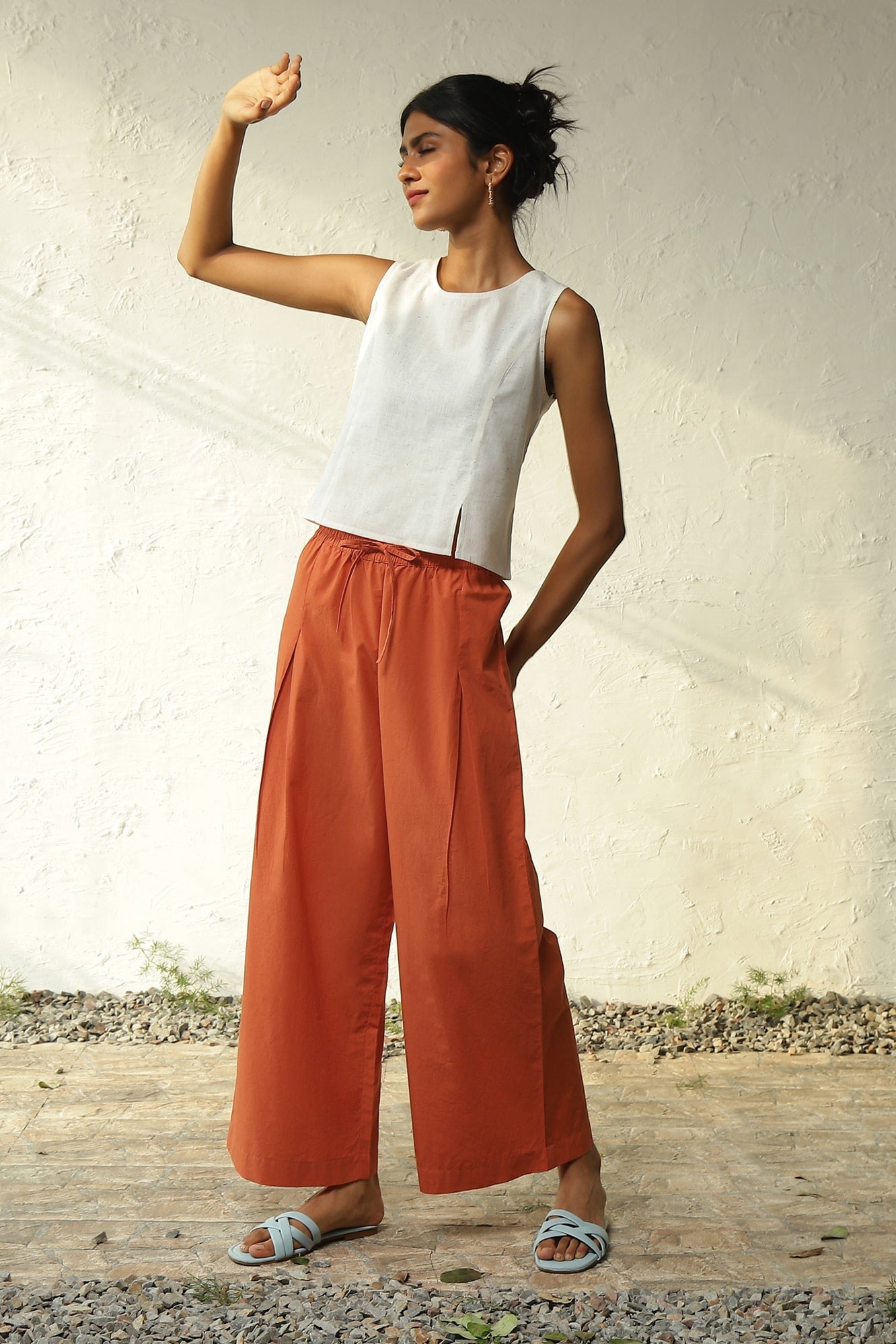 White Cotton Front Slit Top With Orange Palazzo Co-Ord Set at Kamakhyaa by Canoopi. This item is Canoopi, Casual Wear, Complete Sets, Khadi, Natural, Orange, Poplin, Regular Fit, Solids, Vacation Co-ords, White, Womenswear