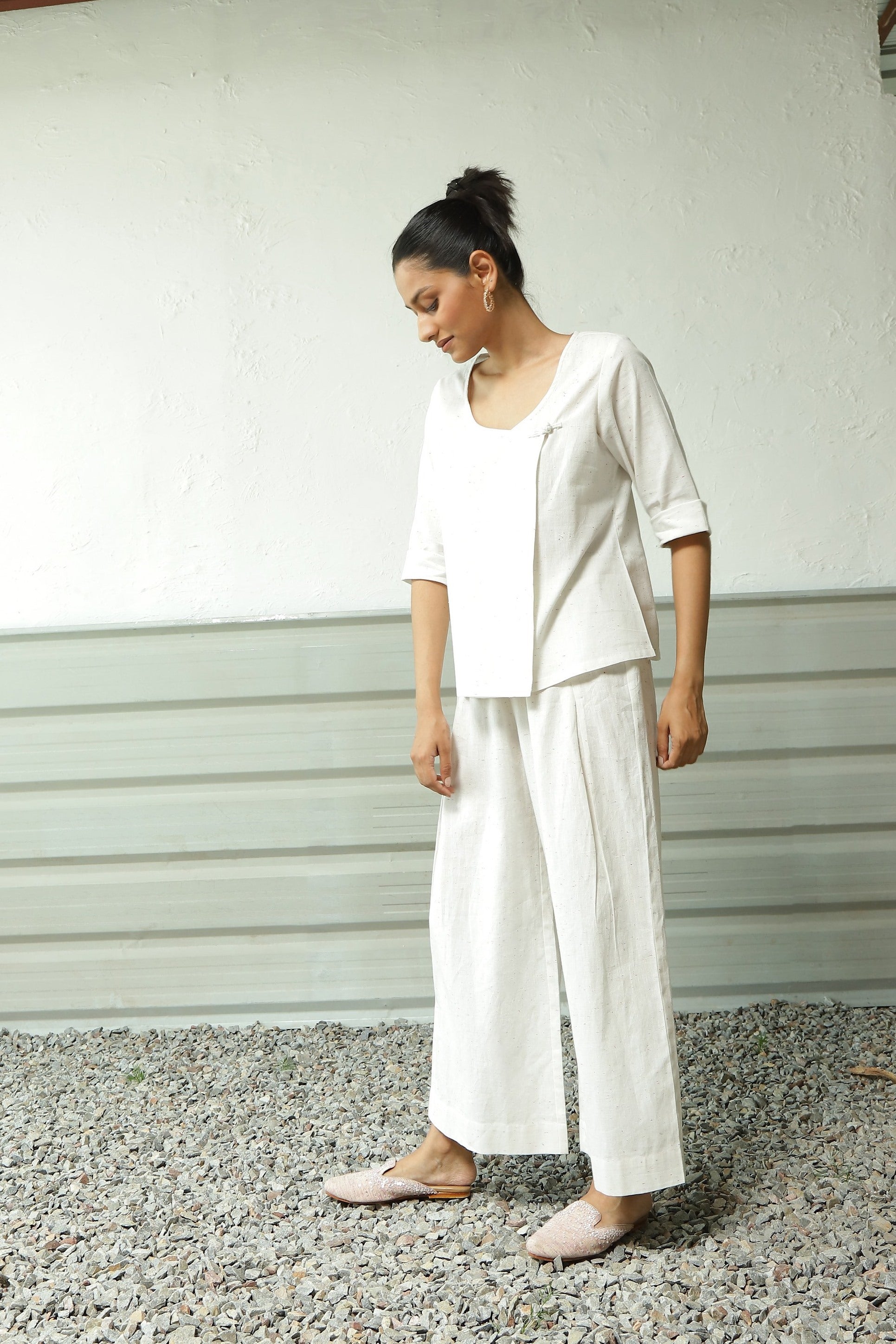 White Cotton Overlap Top Pant Set at Kamakhyaa by Canoopi. This item is Canoopi, Casual Wear, Complete Sets, Khadi, Natural, Regular Fit, Solids, Vacation Co-ords, White, Womenswear