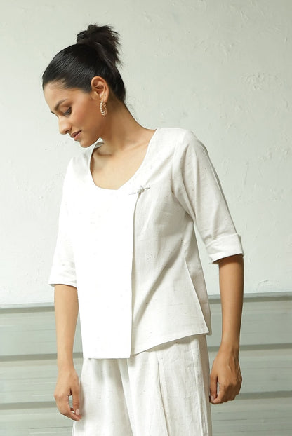 White Cotton Overlap Top Pant Set at Kamakhyaa by Canoopi. This item is Canoopi, Casual Wear, Complete Sets, Khadi, Natural, Regular Fit, Solids, Vacation Co-ords, White, Womenswear