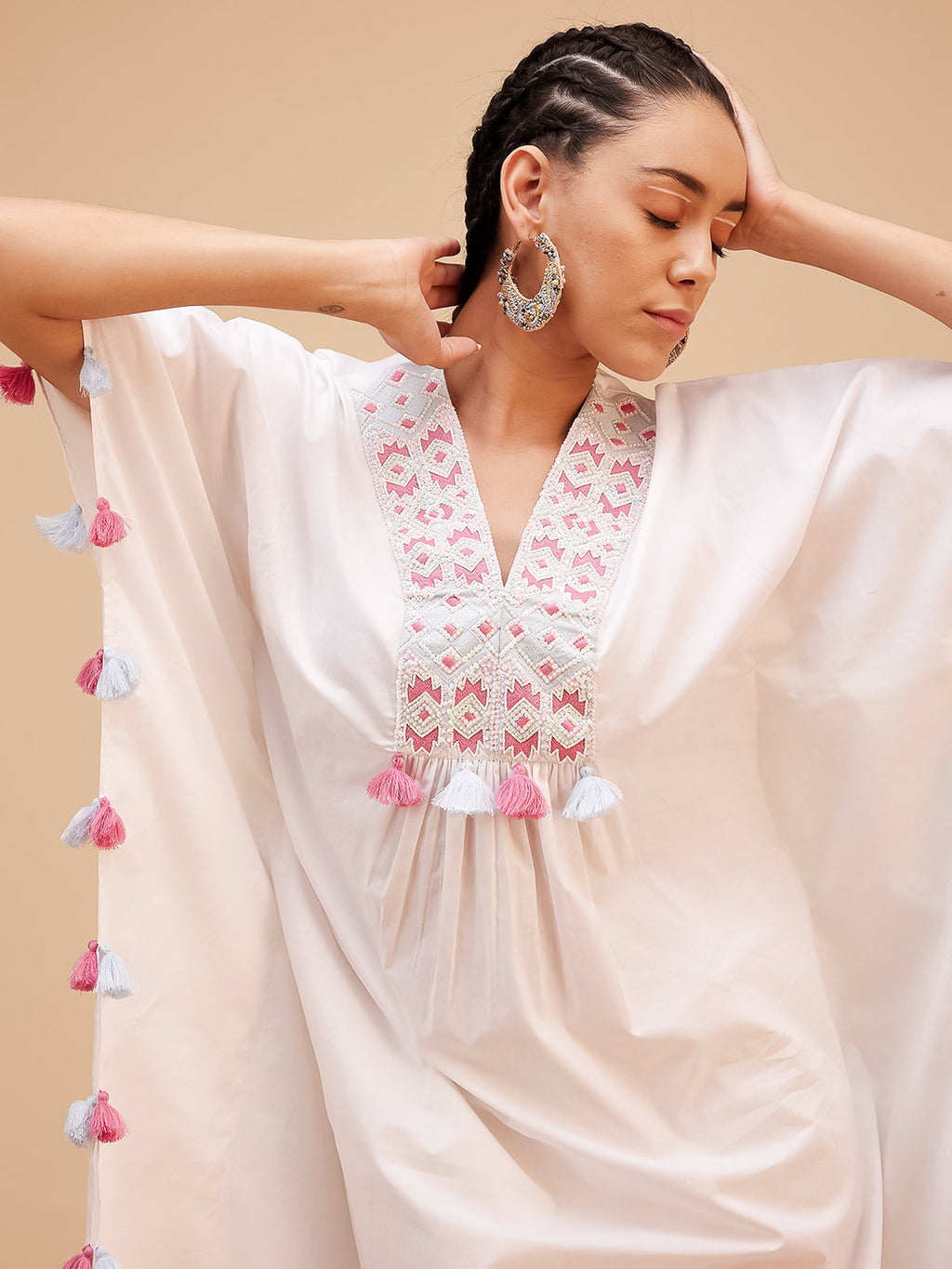 White Hand Embroidered Tassled Kaftan at Kamakhyaa by Bohobi. This item is 100% Cotton, Evening Wear, Hand Embroidered, Kaftans, Regular Fit, Toxin free, White