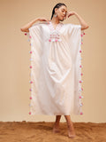 White Hand Embroidered Tassled Kaftan at Kamakhyaa by Bohobi. This item is 100% Cotton, Evening Wear, Hand Embroidered, Kaftans, Regular Fit, Toxin free, White