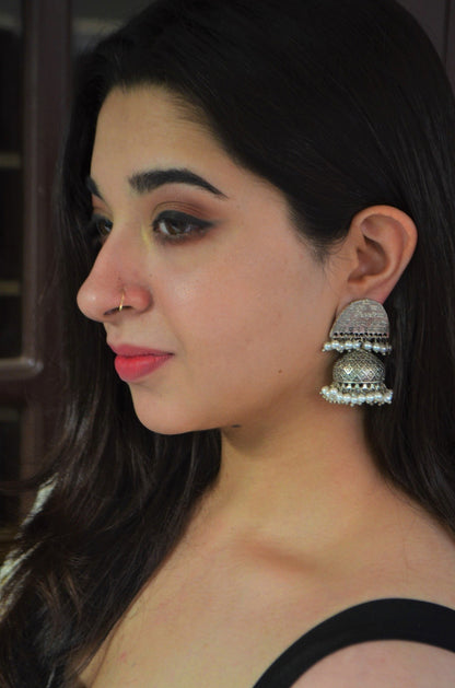 White Jhumkas Shlok at Kamakhyaa by House Of Heer. This item is Alloy Metal, Festive Jewellery, Festive Wear, Free Size, jewelry, July Sale, July Sale 2023, Long Earrings, Natural, Pearl, Solids, Textured, White