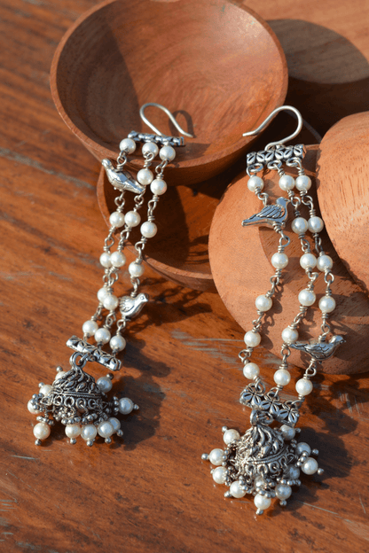 White Jhumkas Tassel Bird at Kamakhyaa by House Of Heer. This item is Alloy Metal, Danglers, Festive Jewellery, Festive Wear, Free Size, jewelry, July Sale, July Sale 2023, Less than $50, Natural, Pearl, Solids, Textured, White